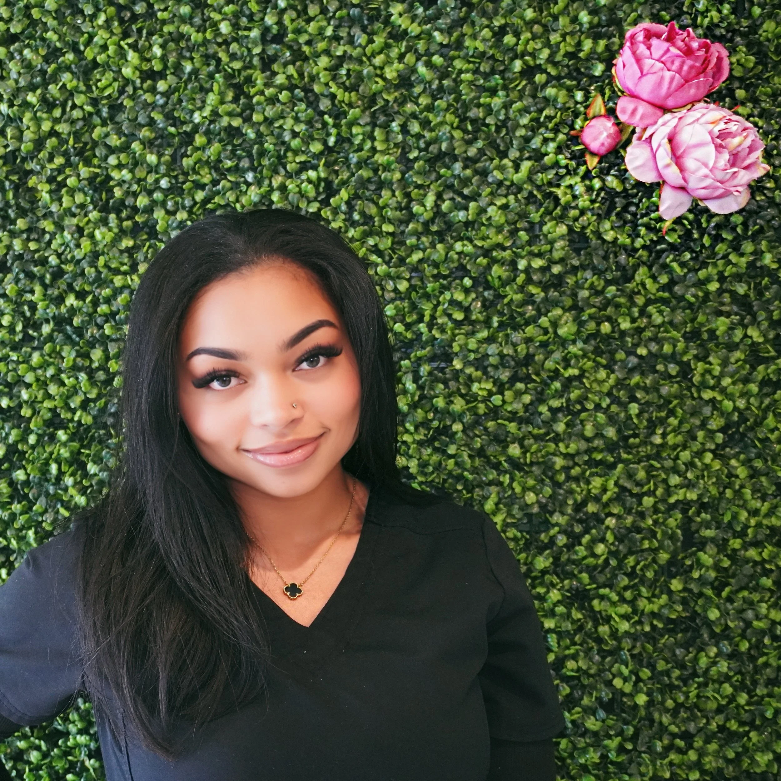 Placeholder image with text 'Photo Coming Soon!' over a textured green background with a pink rose at the top right corner.