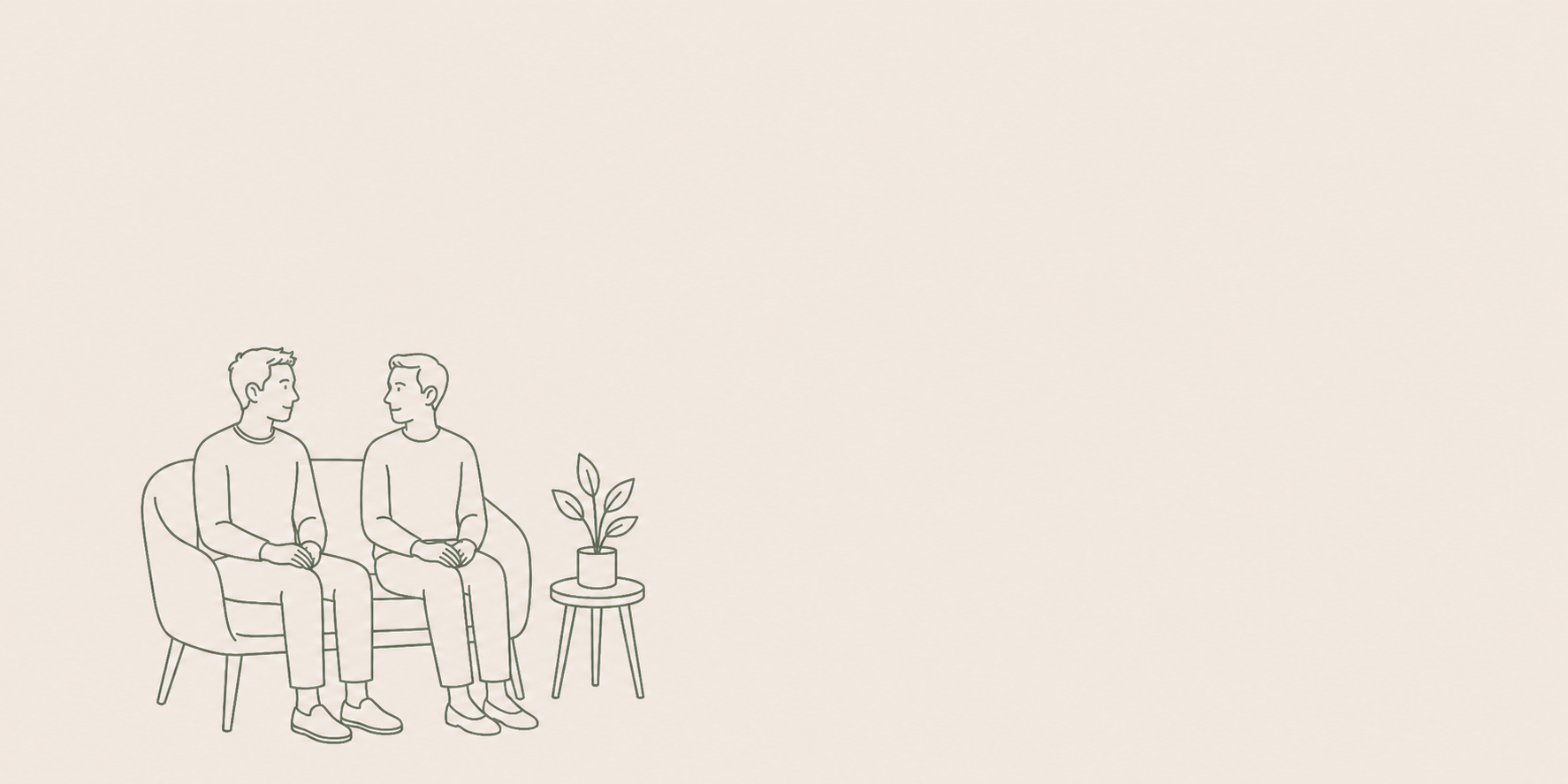 Two men sitting on a couch having a conversation, with a small side table holding a potted plant next to them.