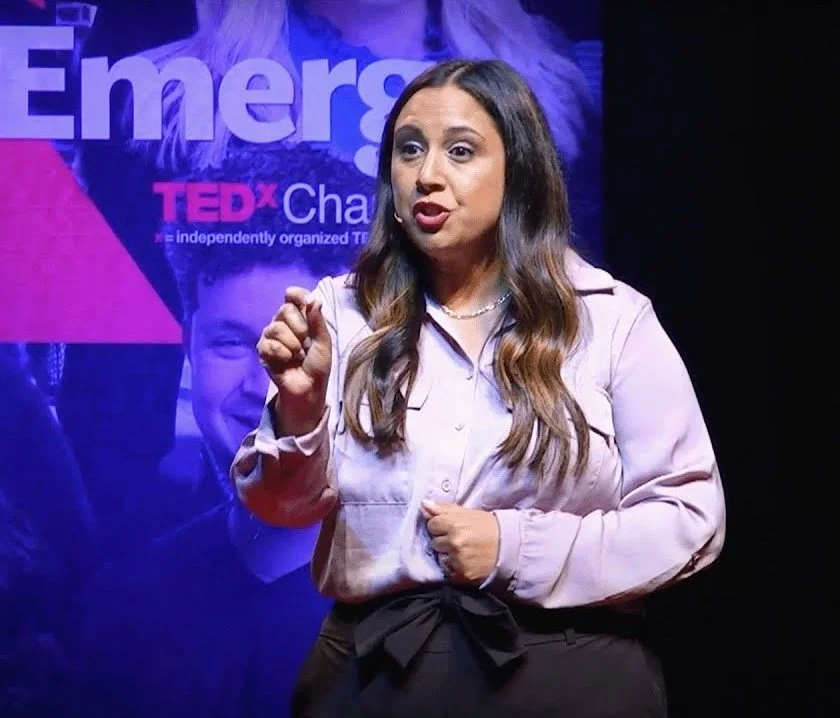 Natalie Hauff presenting on the TedxCharleston stage in 2023.