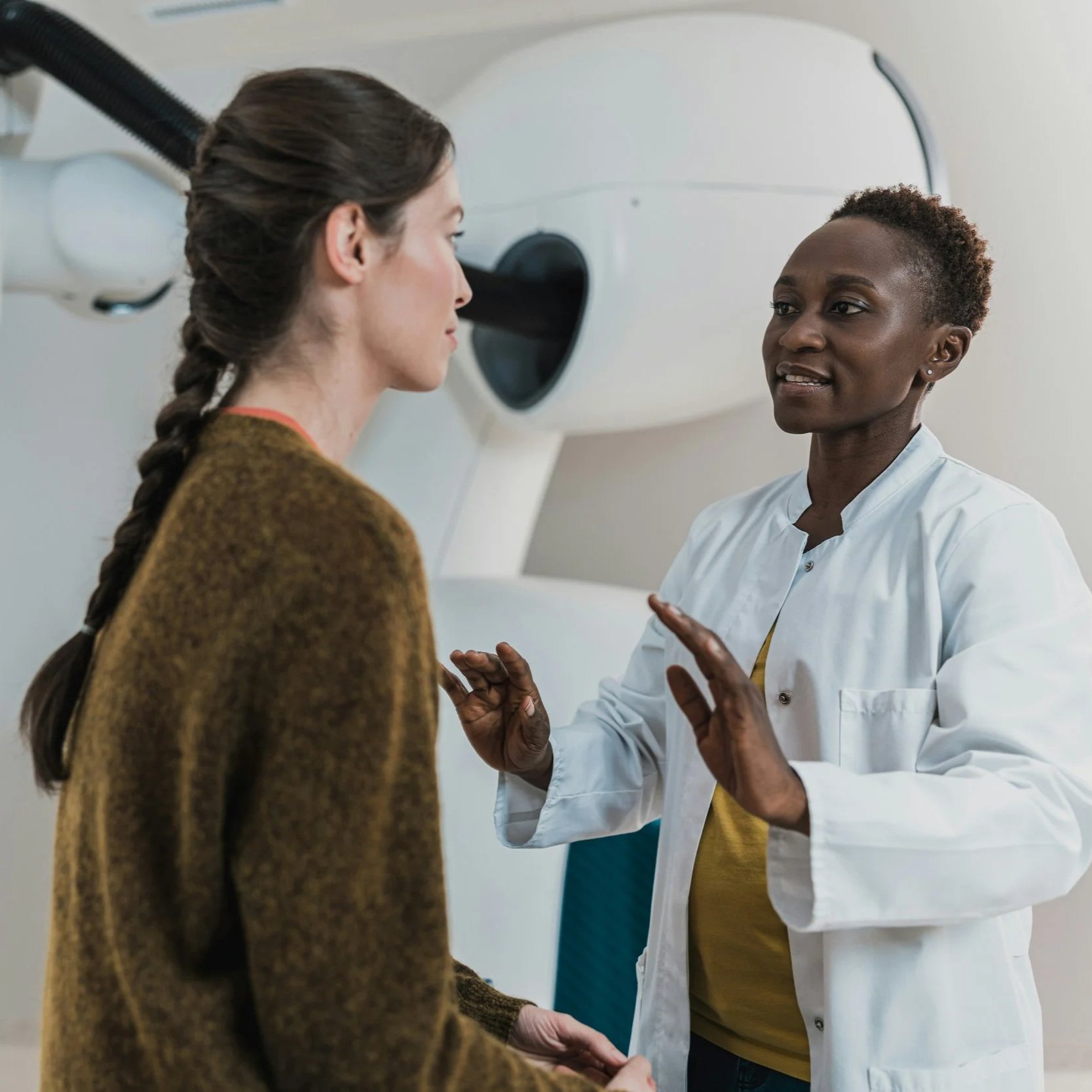 A woman talks with her doctor