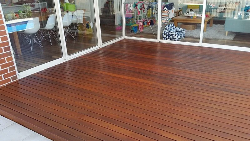 Hardwood deck connecting house entrance to garden.