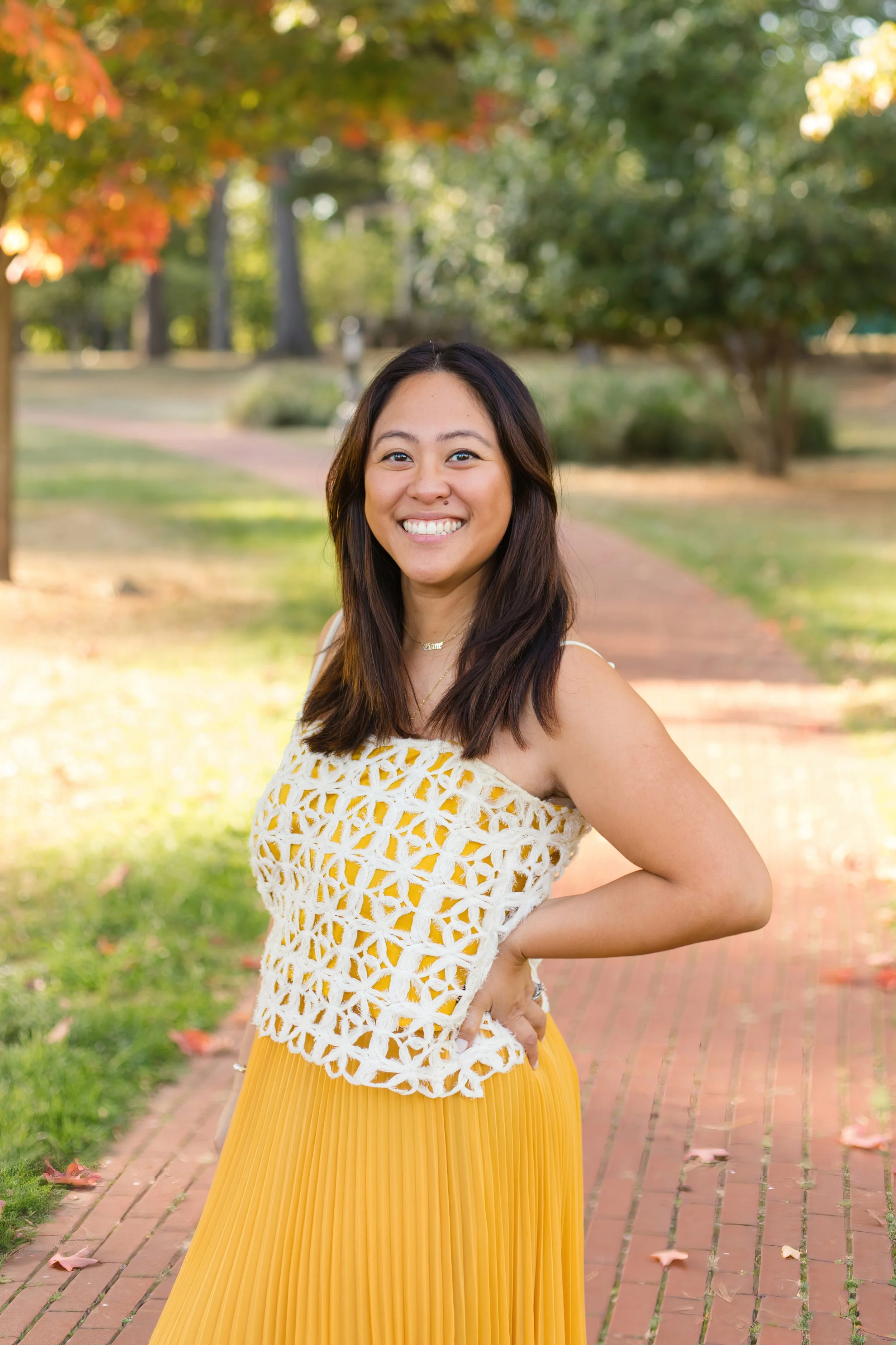 Smiling person in a white shirt in an autumn setting