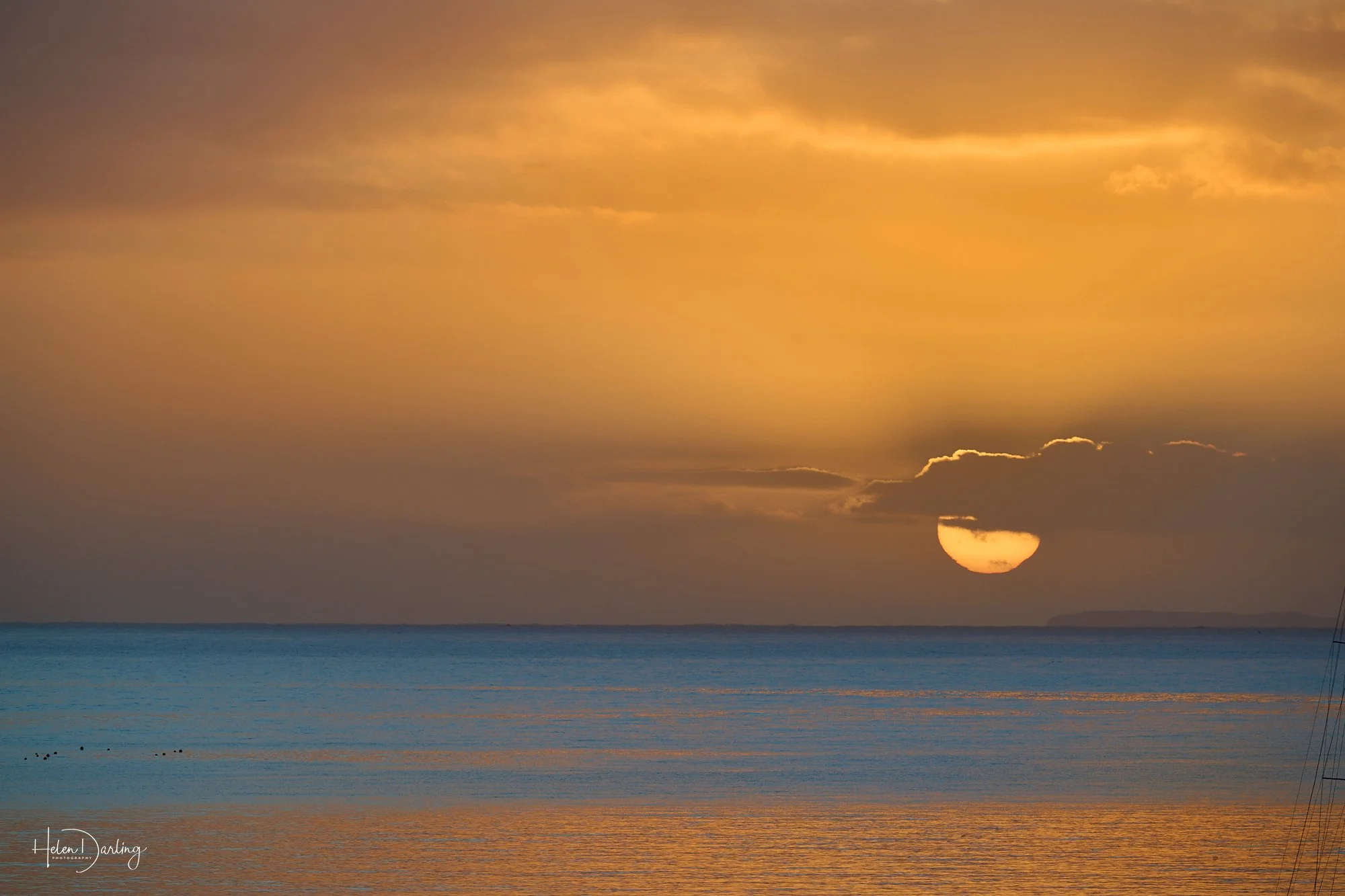 The sun rises over Halfmoon Bay, Stewart Island