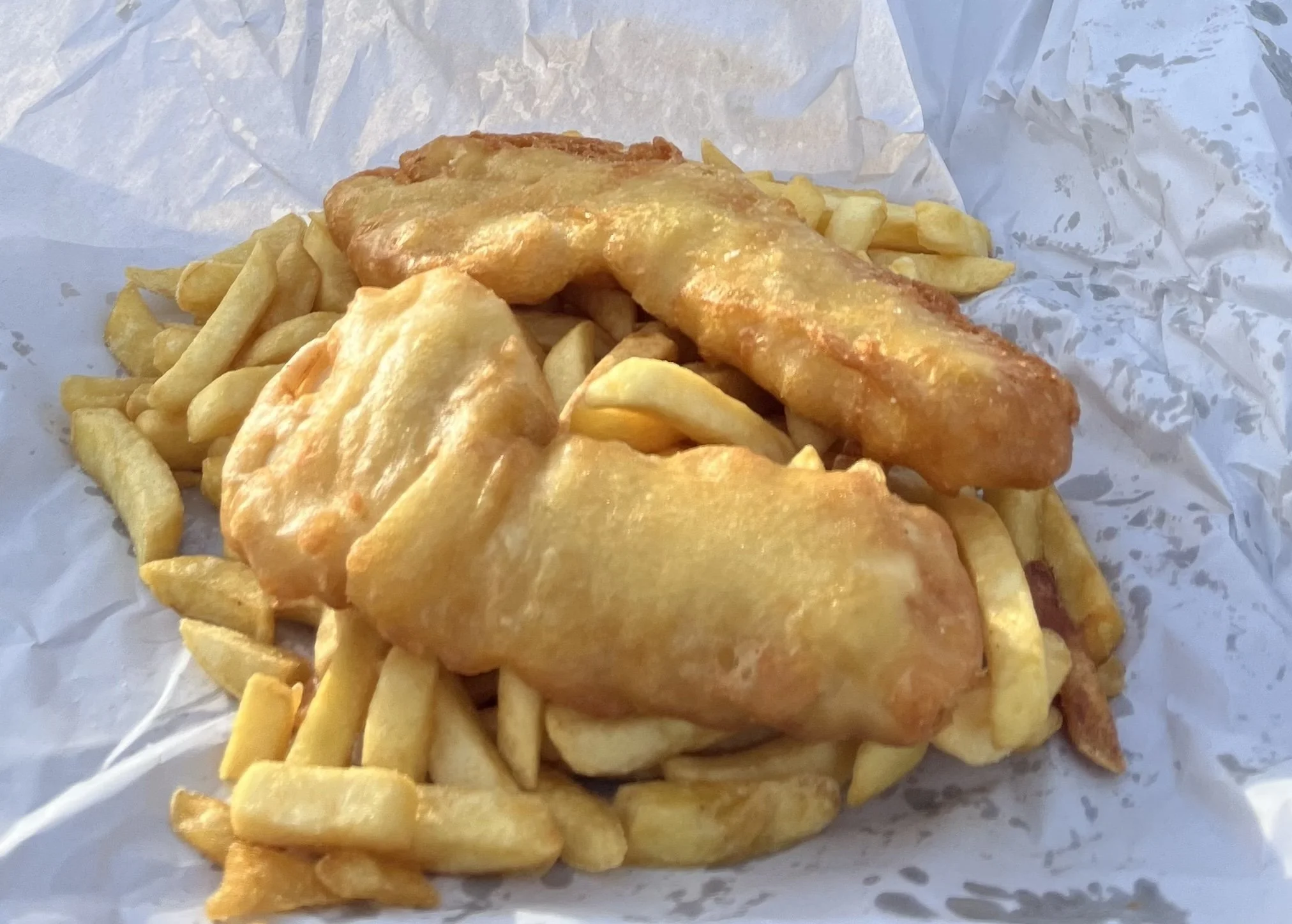 A pile of delicious fresh fish and chips