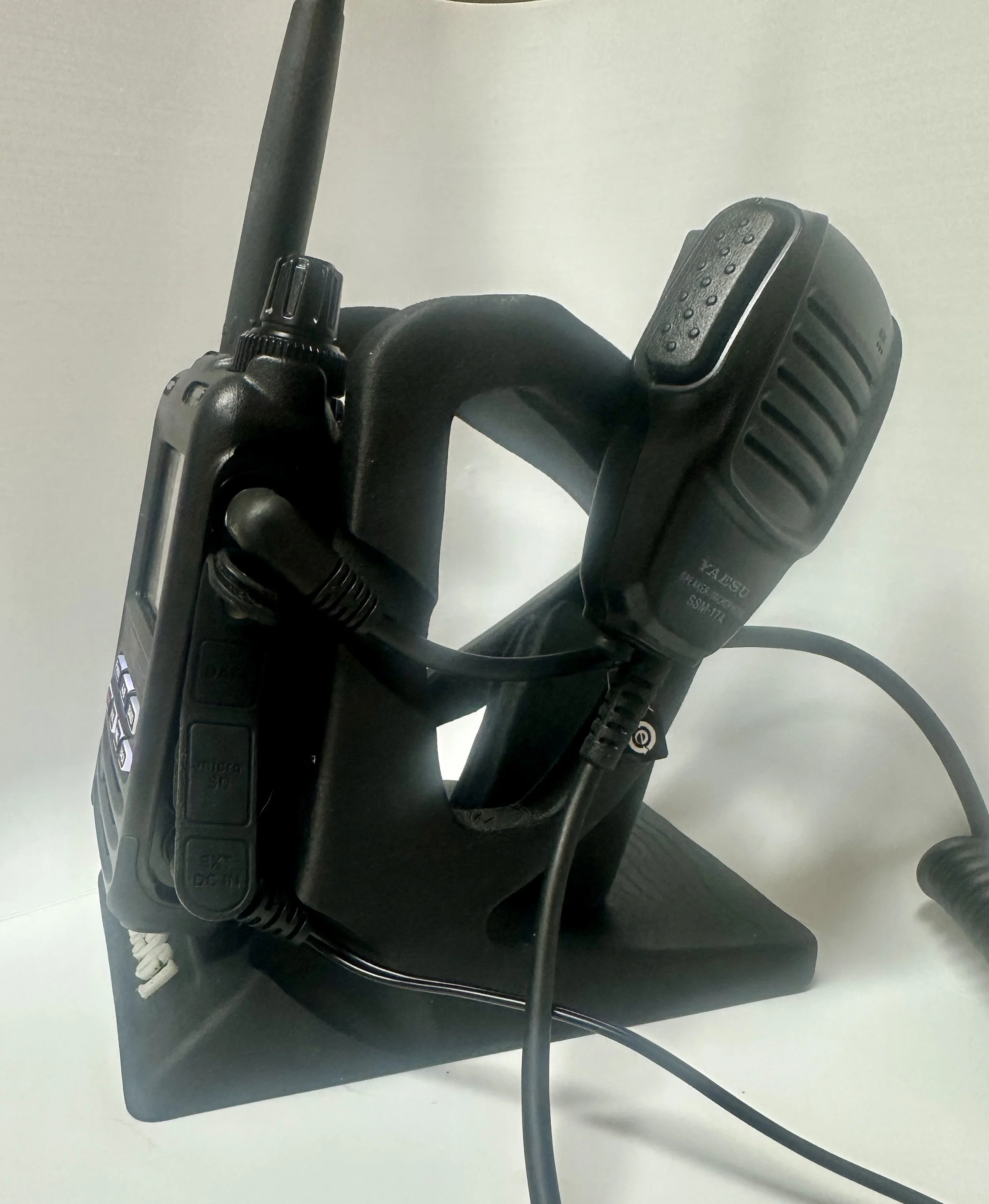 Yaesu FT5D radio seated in custom RocketDock Elite cradle with hand mic and SD card—complete bundle view