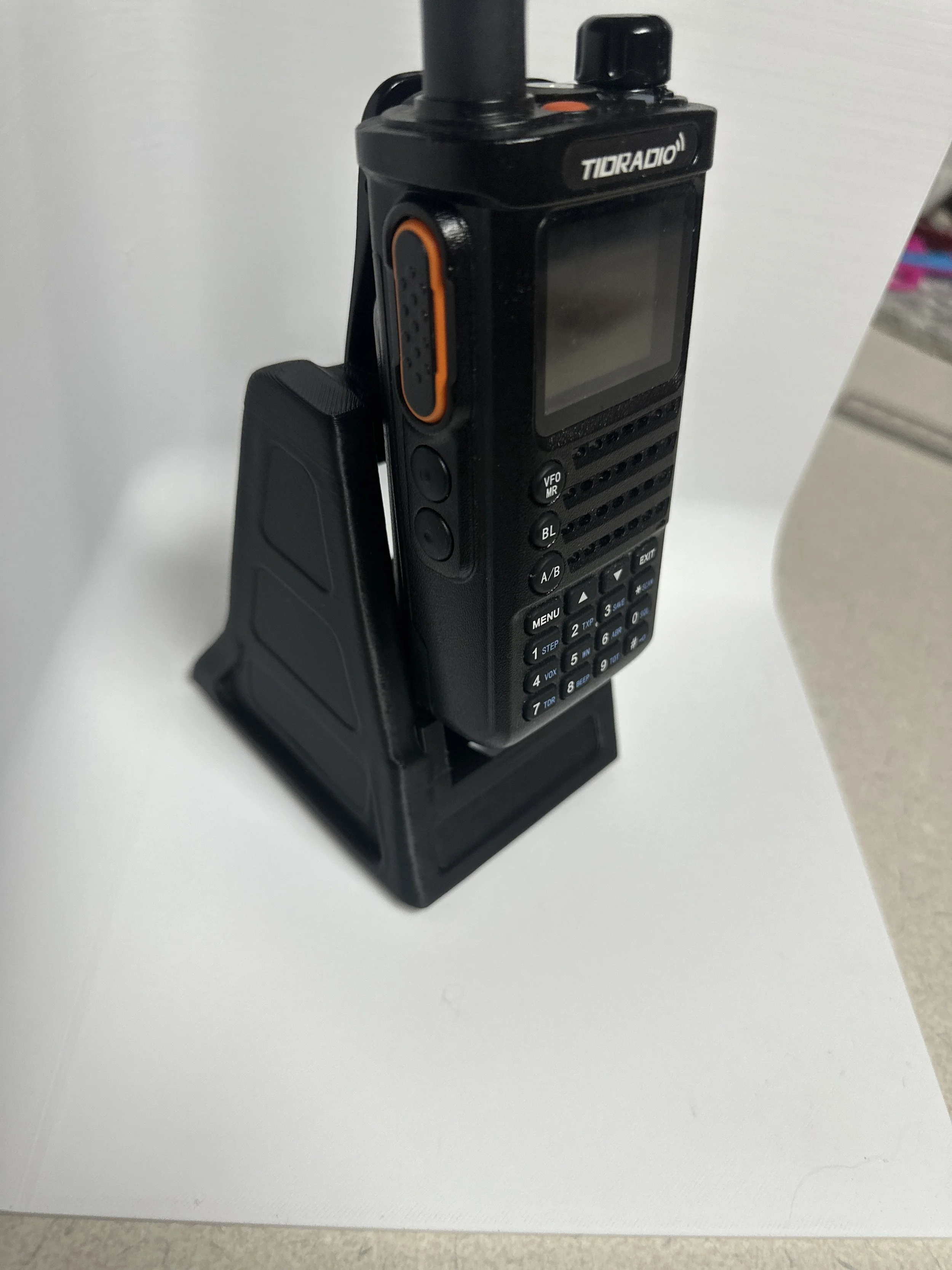 Tidradio H8 can be used with this model by utilizing its belt clip