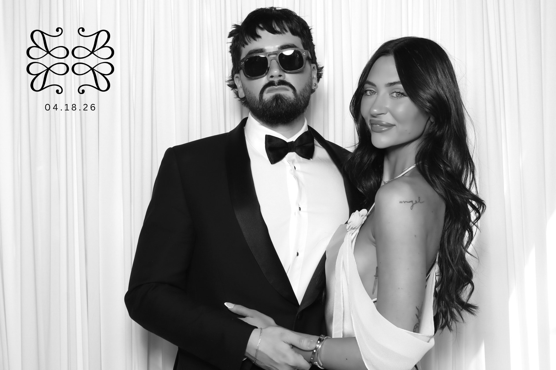 couple posing in luxury wedding photo booth