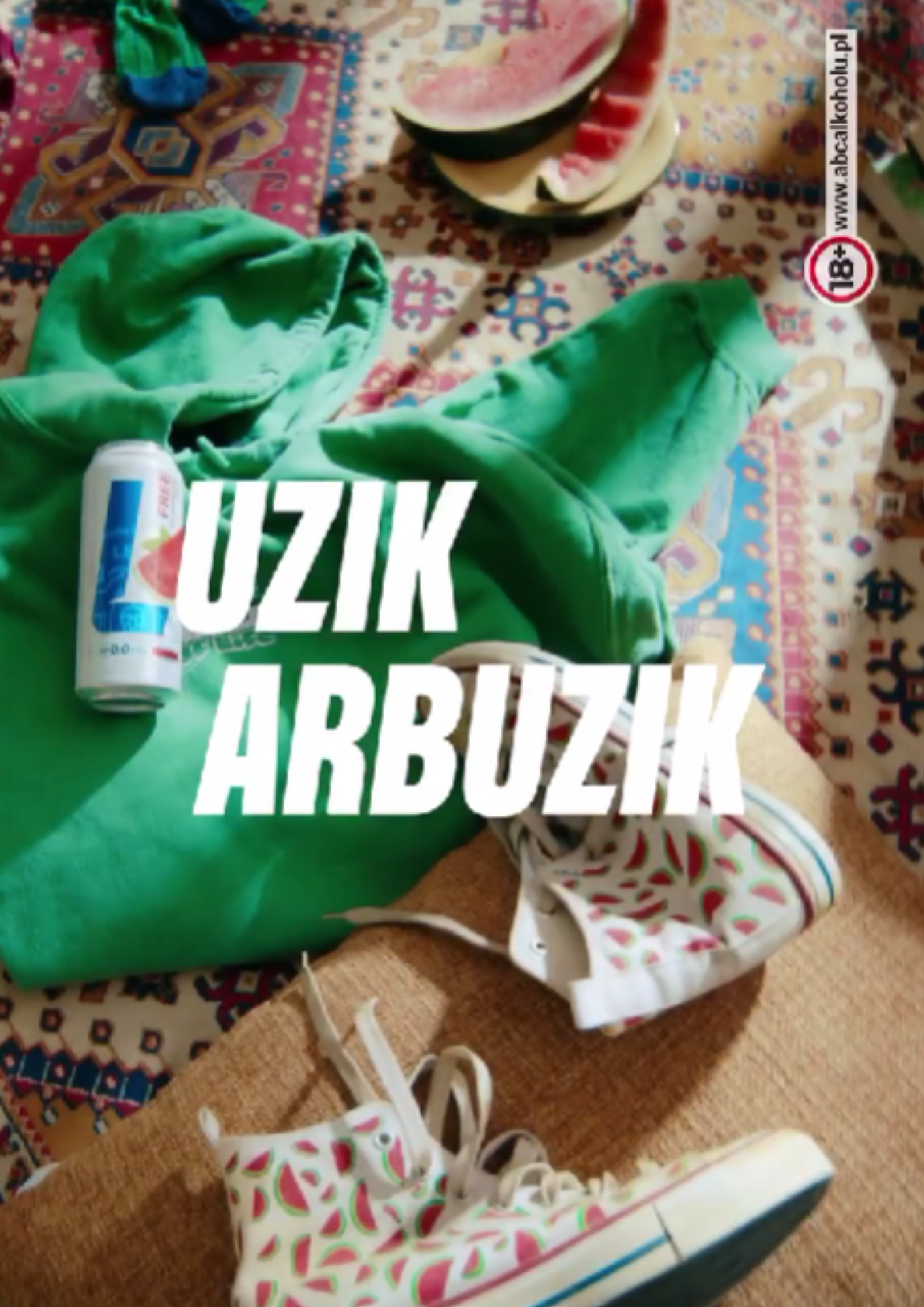 Colorful patterned carpet with green hoodie, can, watermelon slices, white sneakers with watermelon pattern, and other clothing items scattered on the floor.