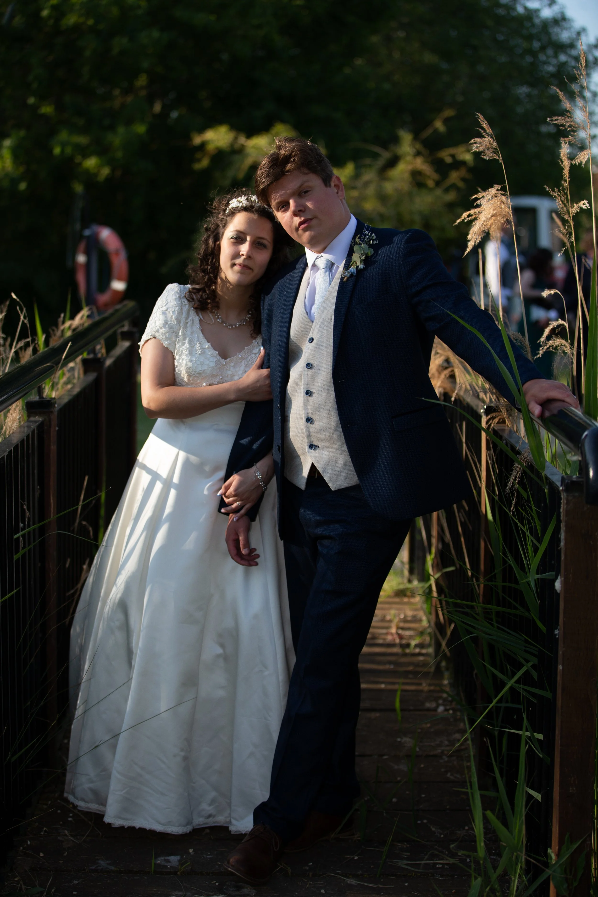 Bride and groom on the garden footbridge at The Thatched Cottage Restaurant in Sutterton, near Boston, Lincolnshire.