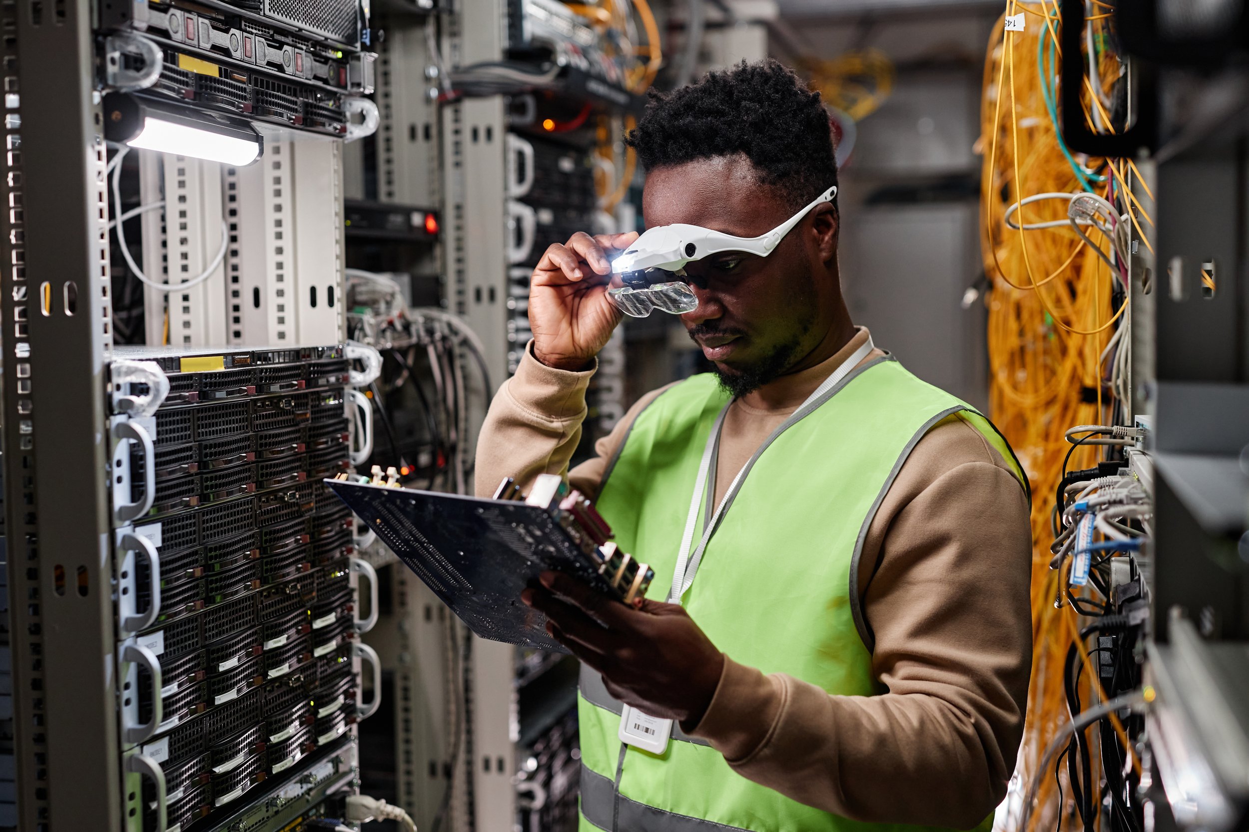 technician-repairing-servers-data-center-inspecting-computer-parts.jpg