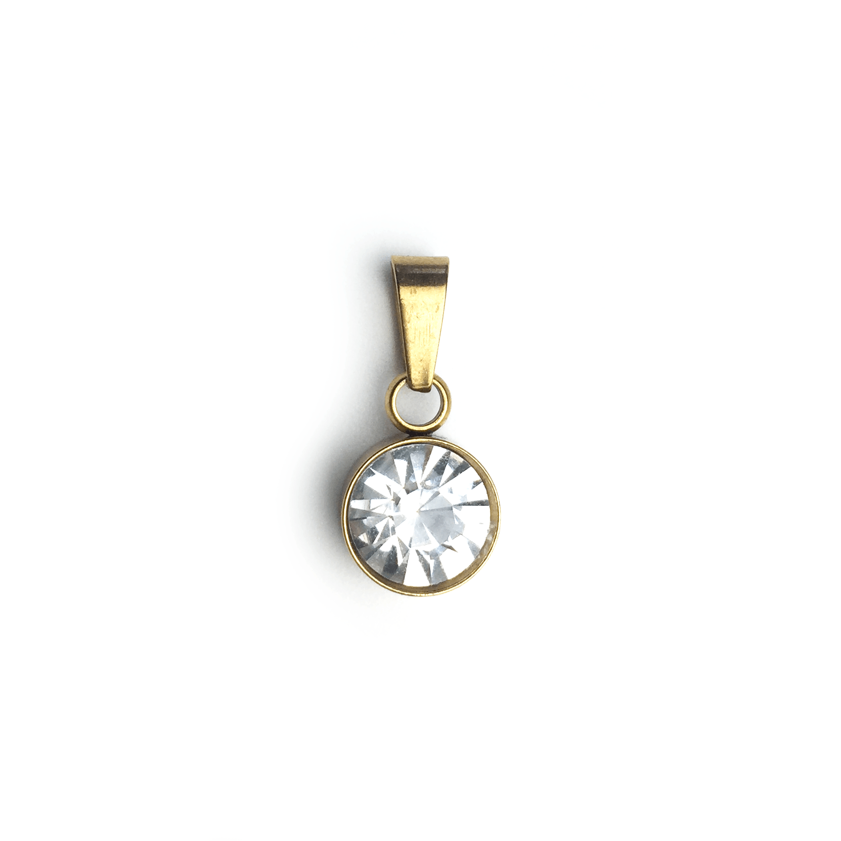Gold pendant with a large clear gemstone in a round setting.