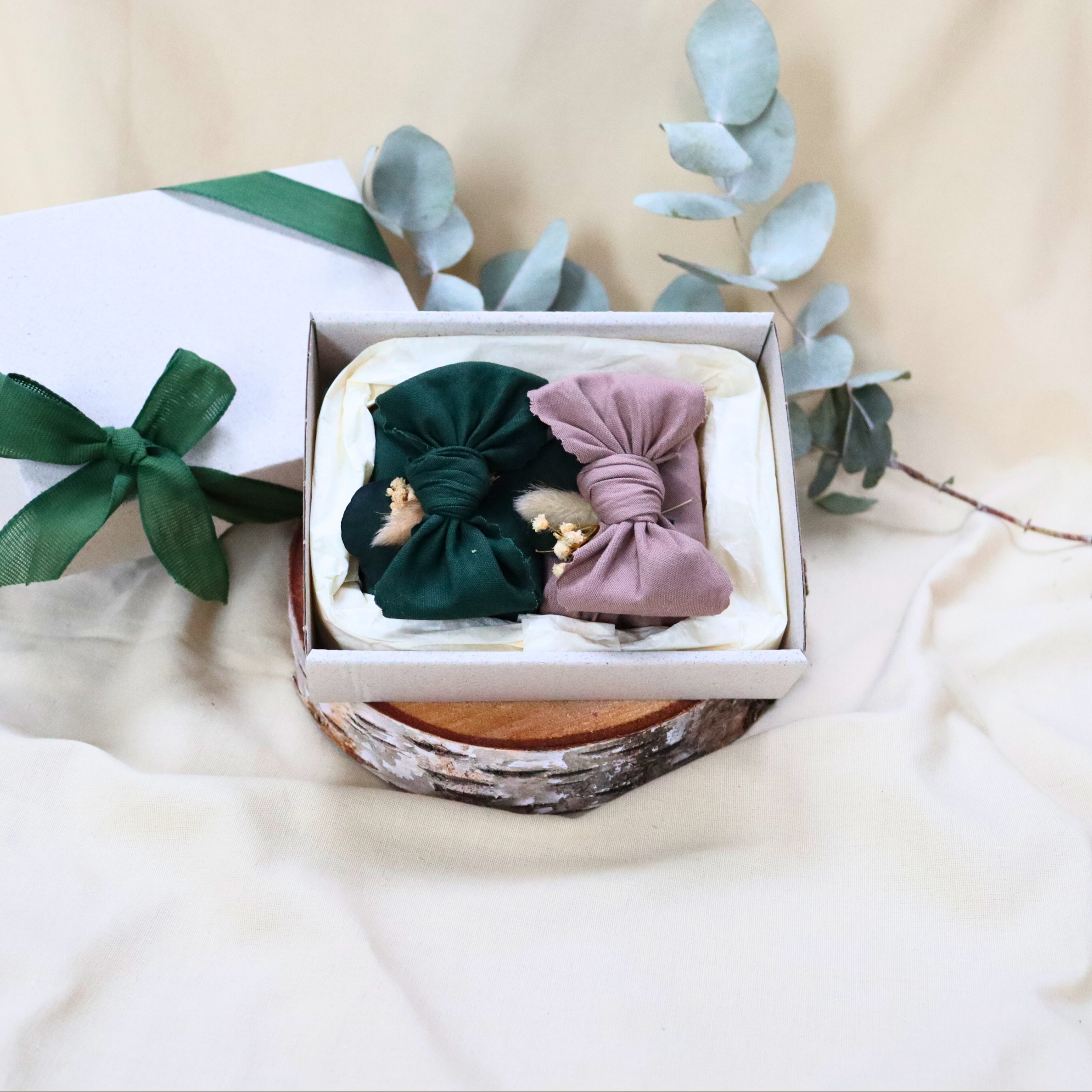 Two-handmade-soaps-with-green-mauve-furoshiki-wraps.png