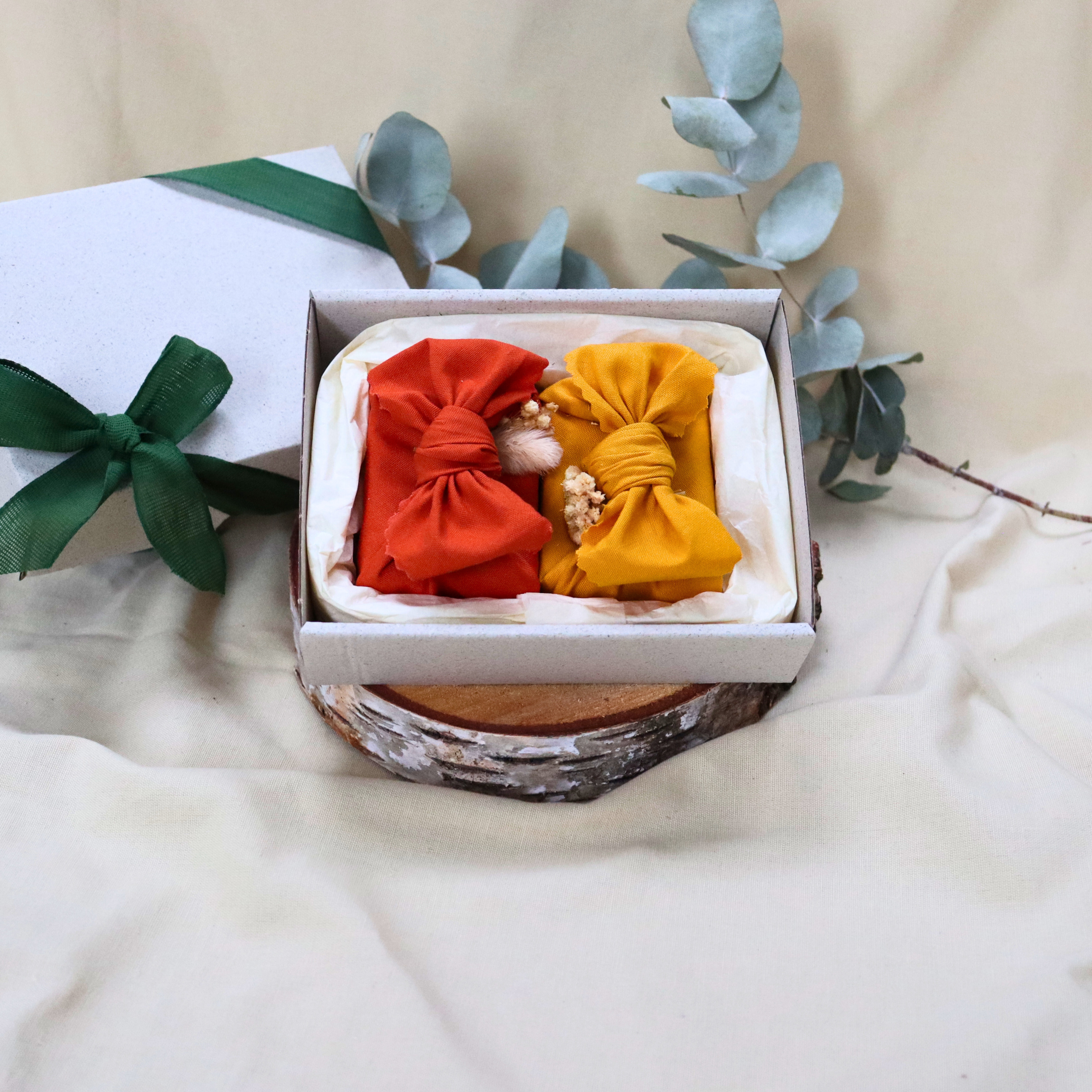 Two-handmade-soaps-with-orange-yellow-furoshiki-wraps.png