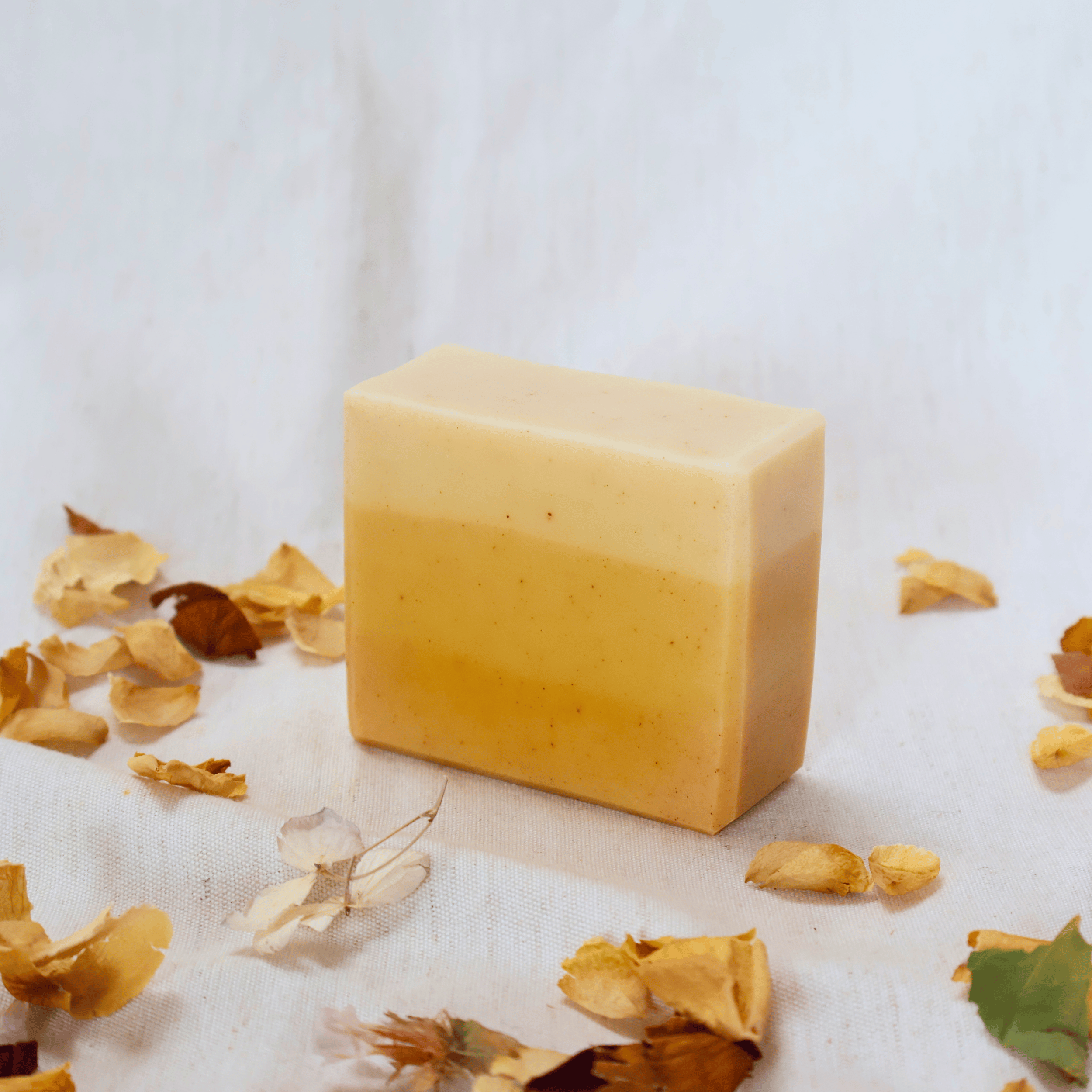 Handmade_natural_turmeric_citrus_soap_bar_close-up.png