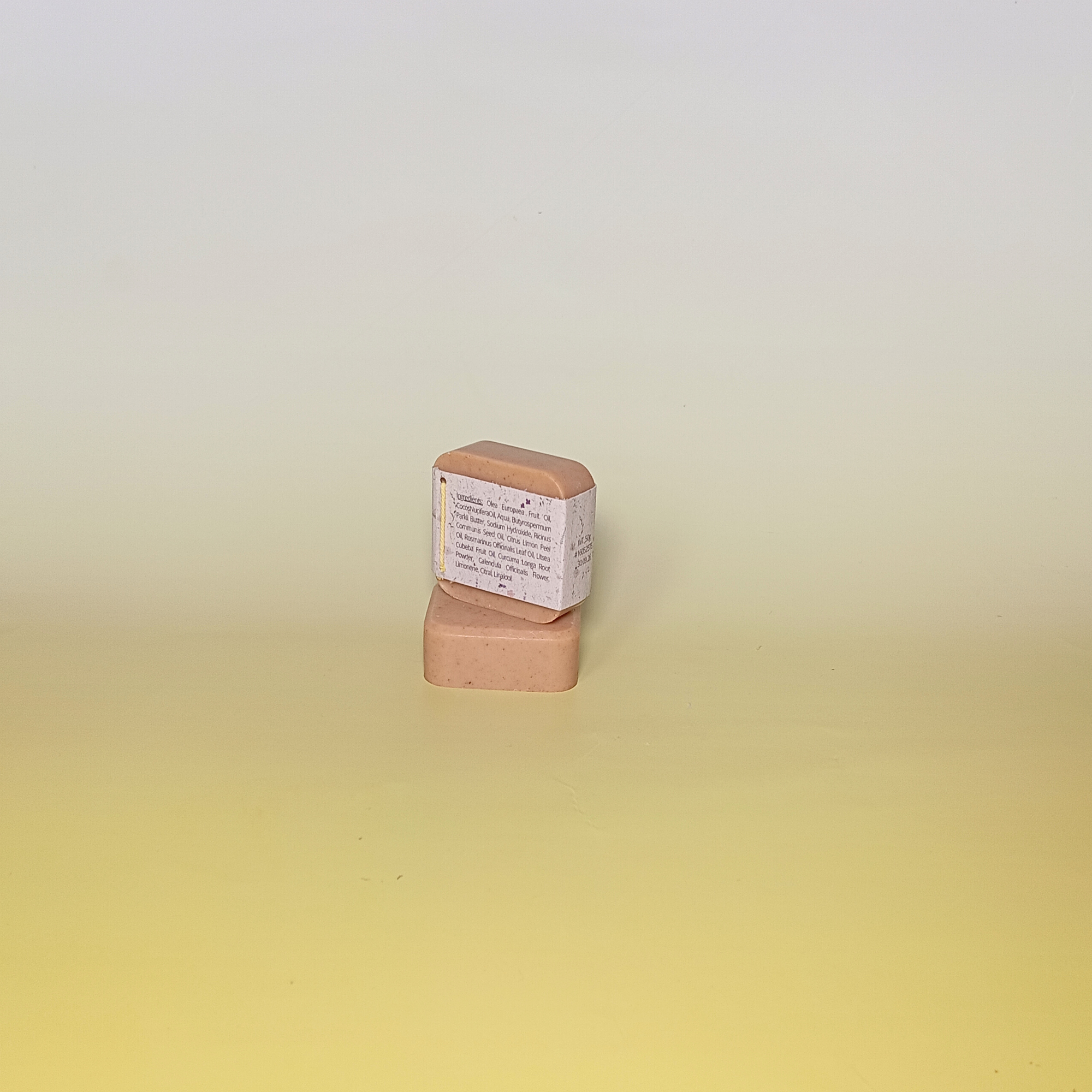 Turmeric golden soap wrapped in grass paper sleeve