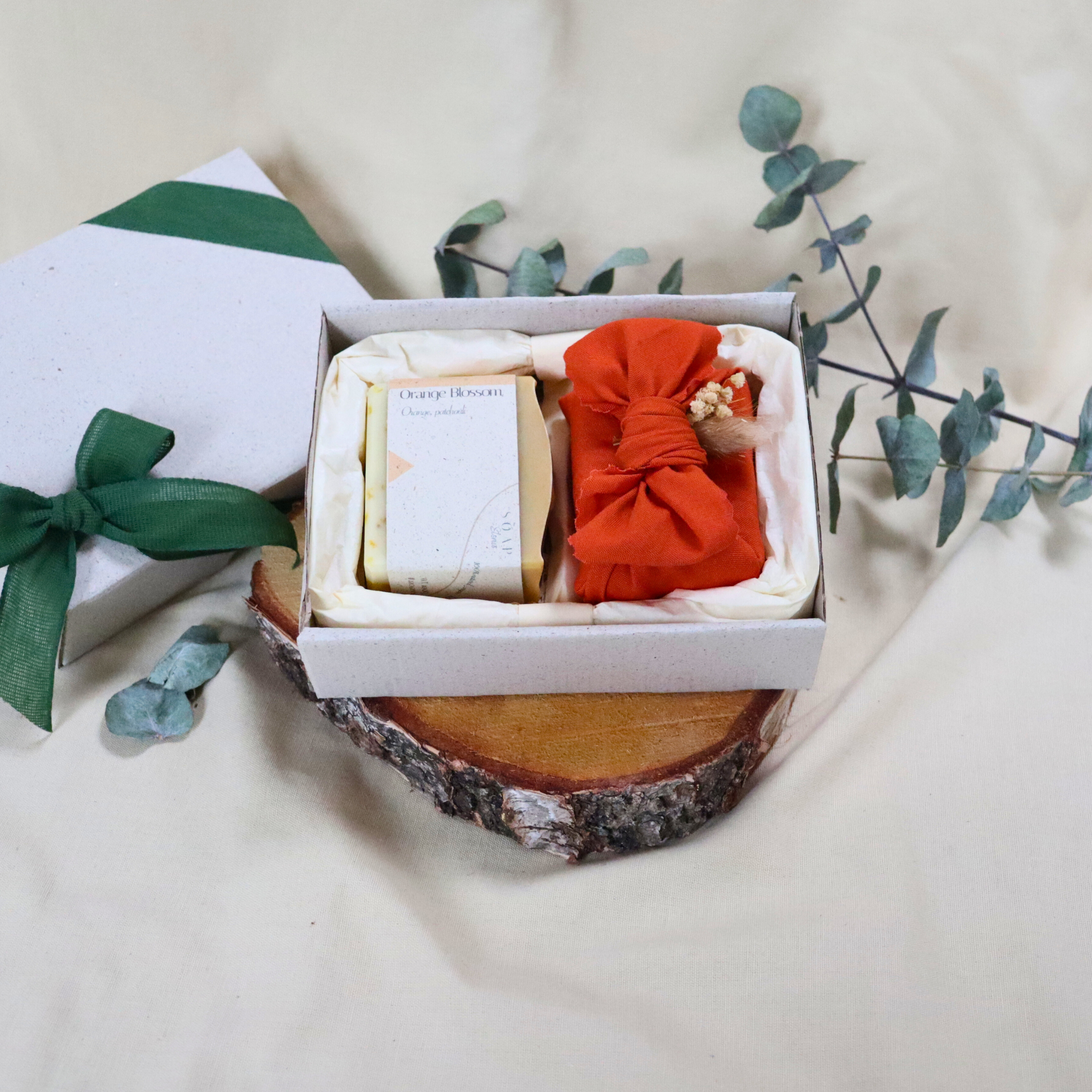 Two-handmade-soaps-with-orange-furoshiki-wrap.png