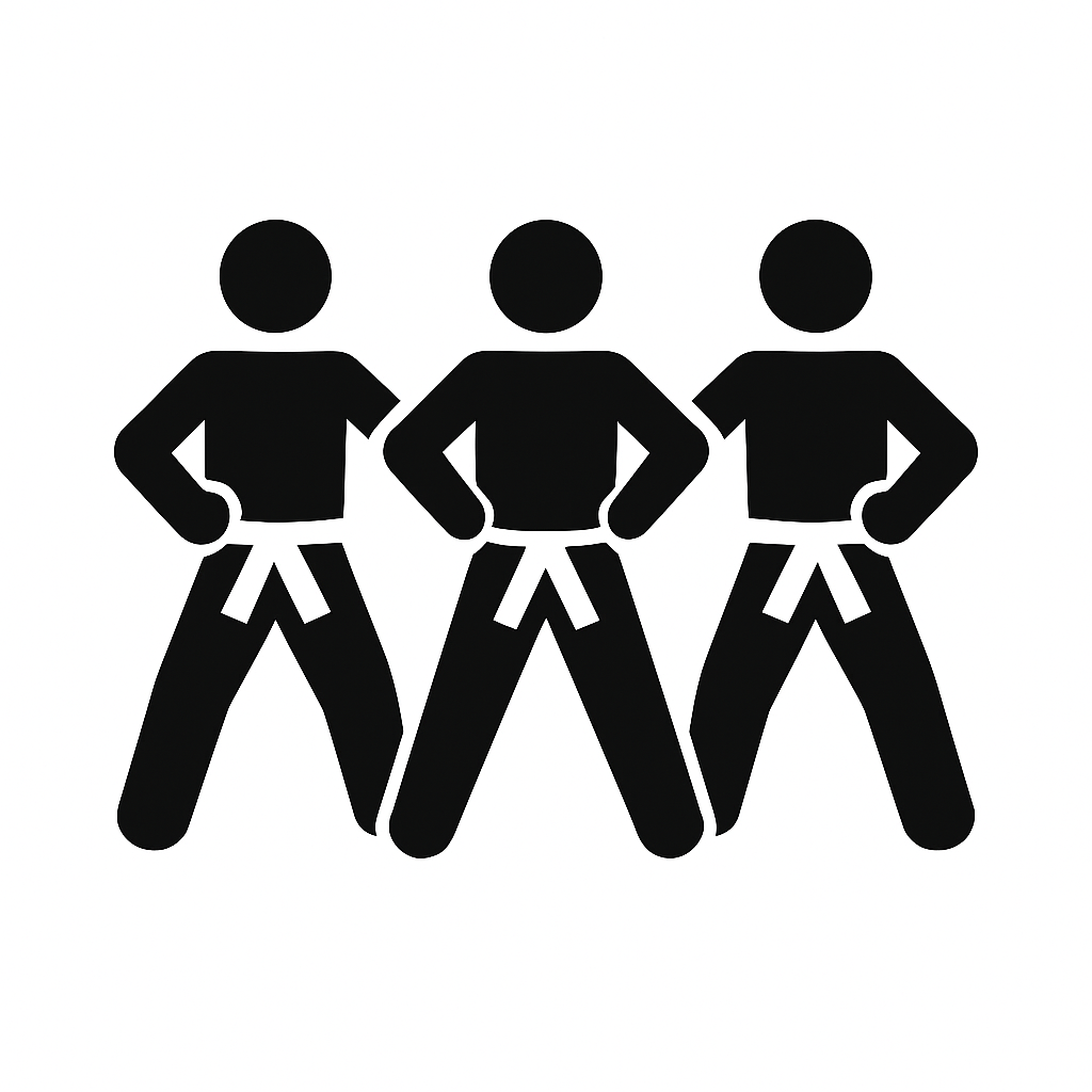 Three karate students standing side by side in matching stances, representing focus, discipline, and respectful training at The Karate Workshop.