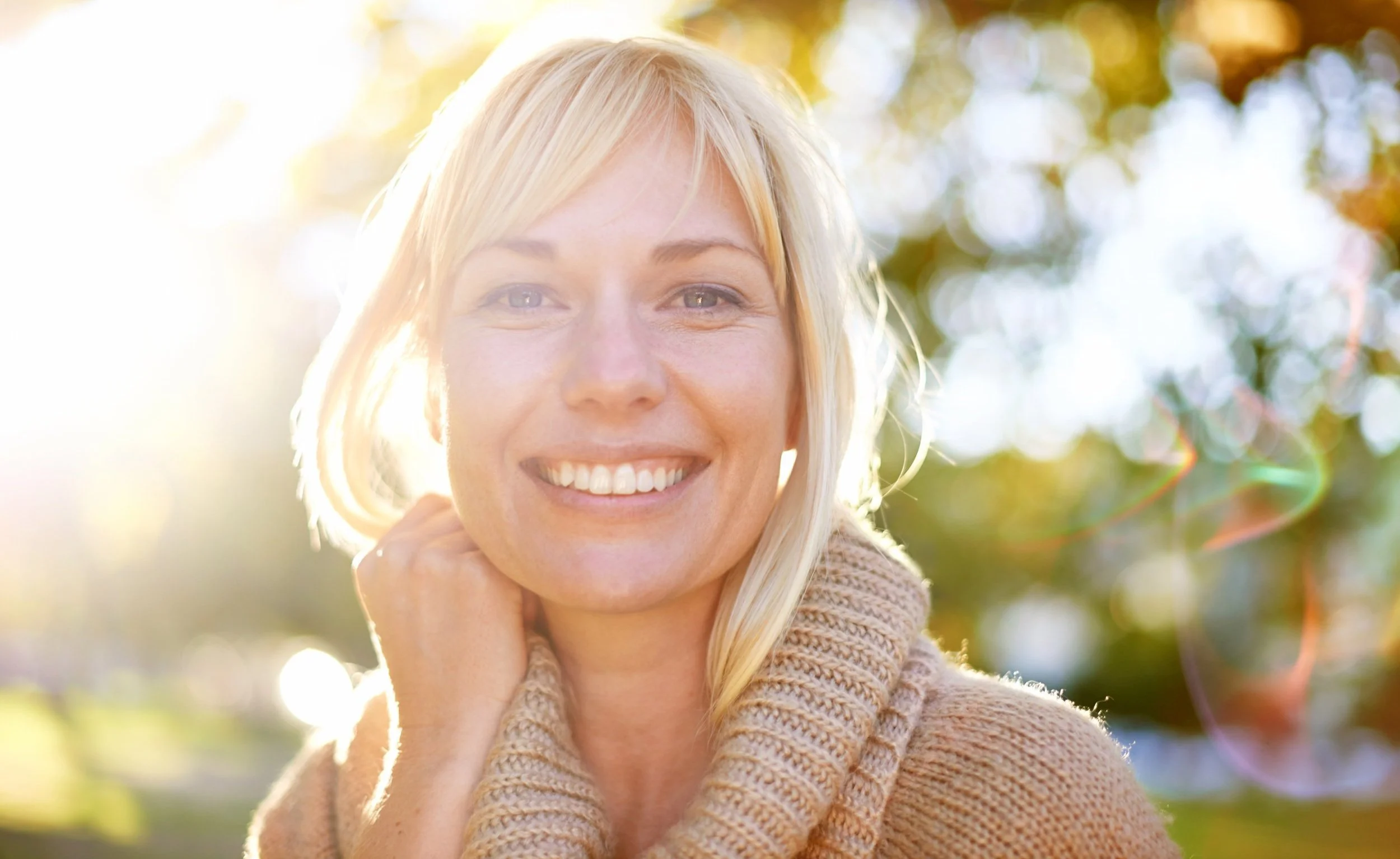 Healthy middle-aged woman in sunlight