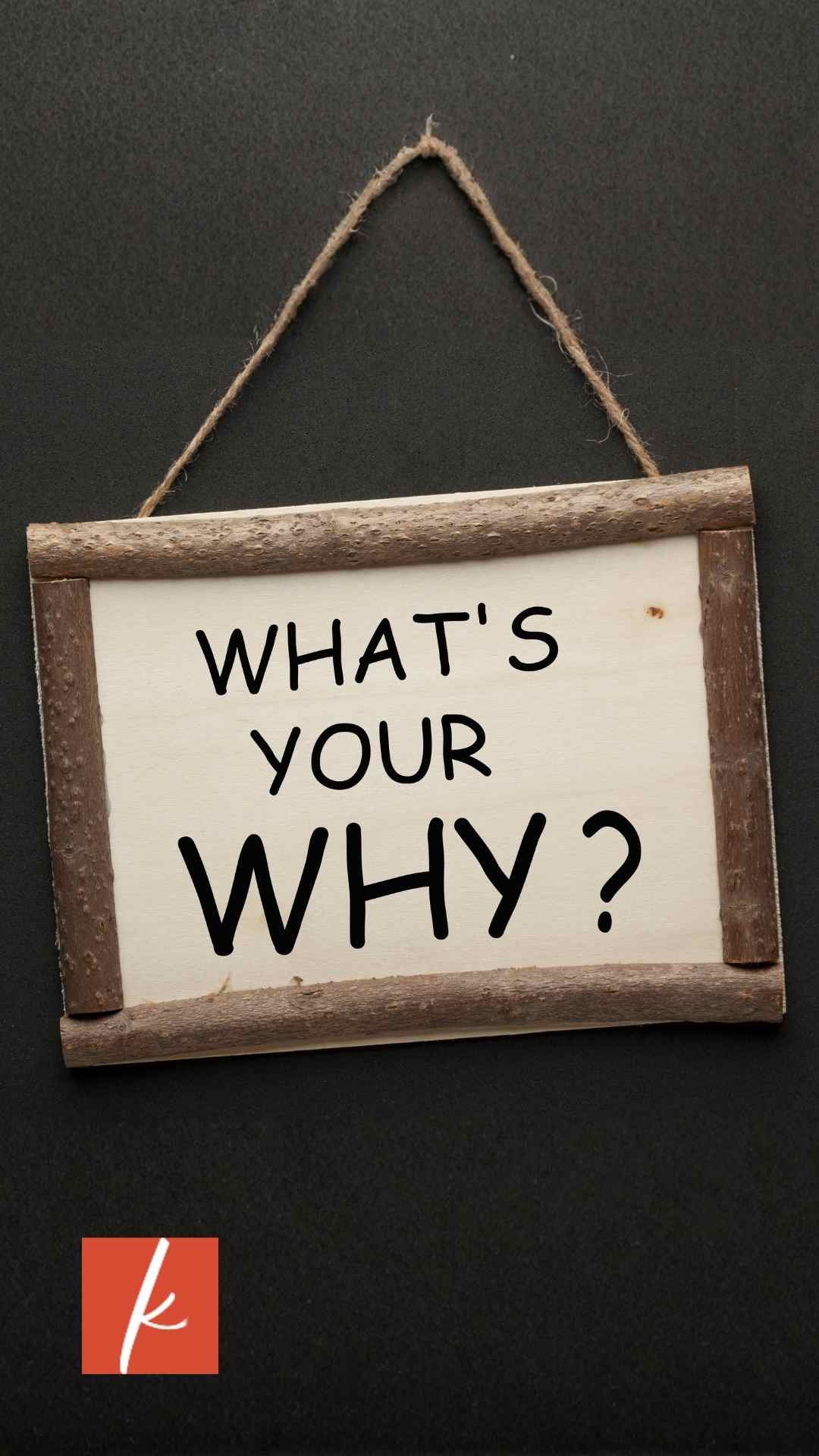 Sign hanging on wall that has the words "What's your why?" written on it