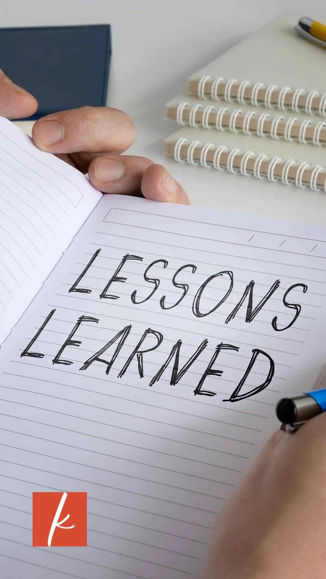 Notebook with the words Lesson Learned at the top of the page
