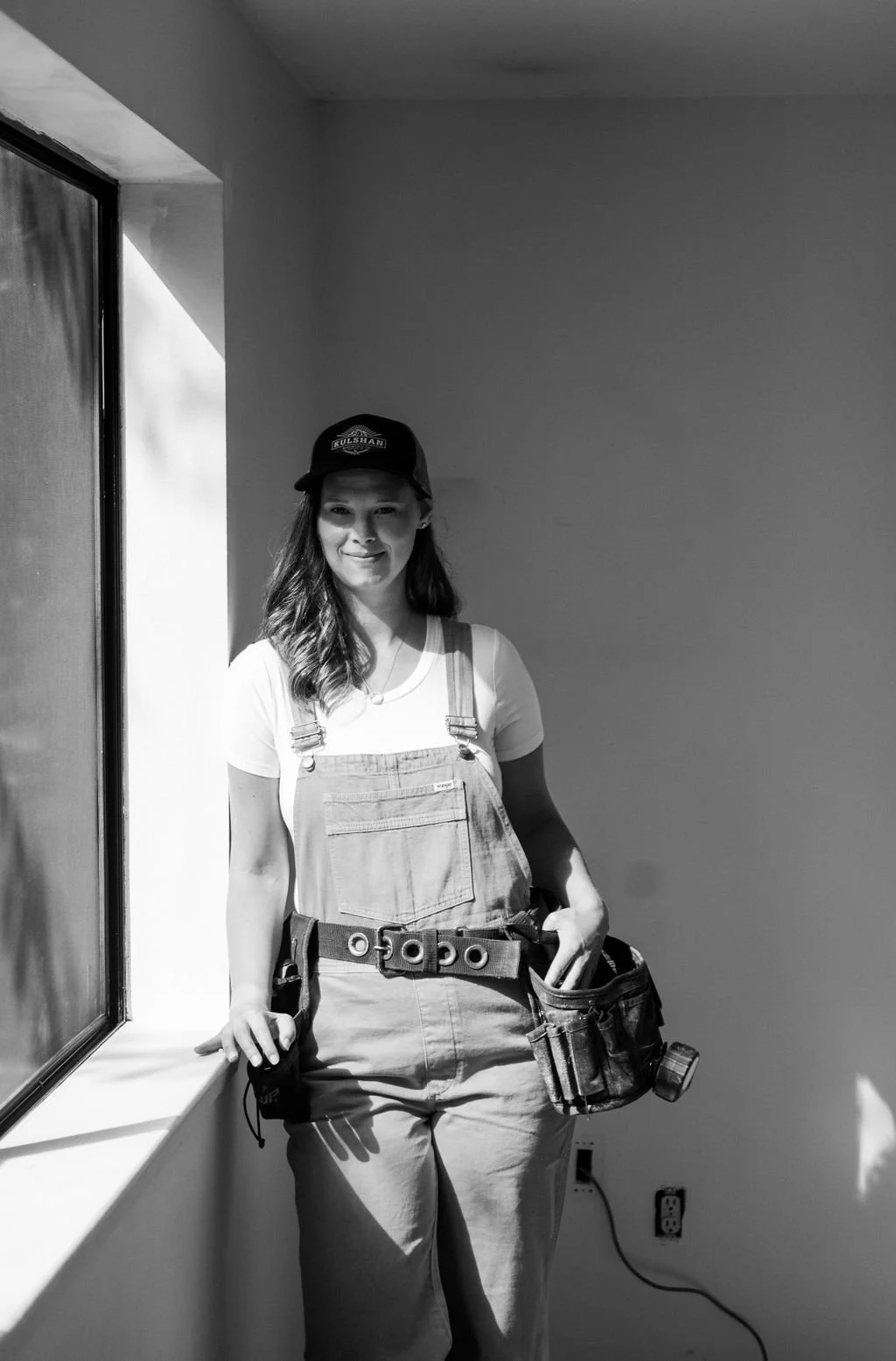Real estate broker and investor Ashleigh Abhold inside one of her personal renovation projects.