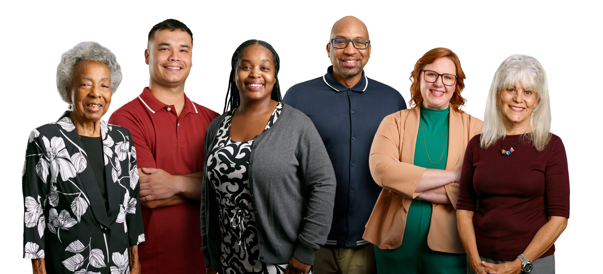 Group of six diverse adults smiling and standing together against a dark background.
