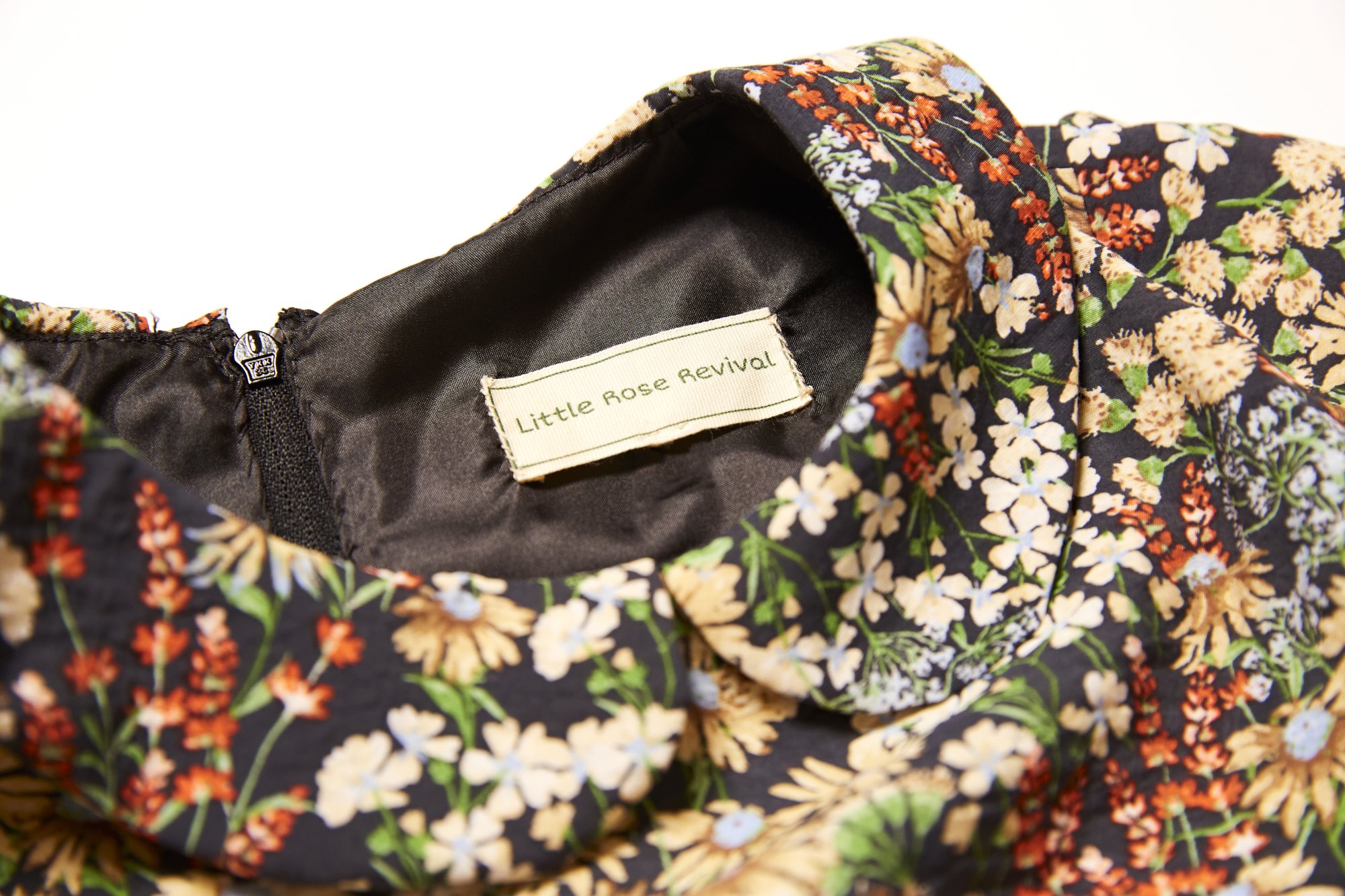 Little Rose Revival tag inside floral garment
