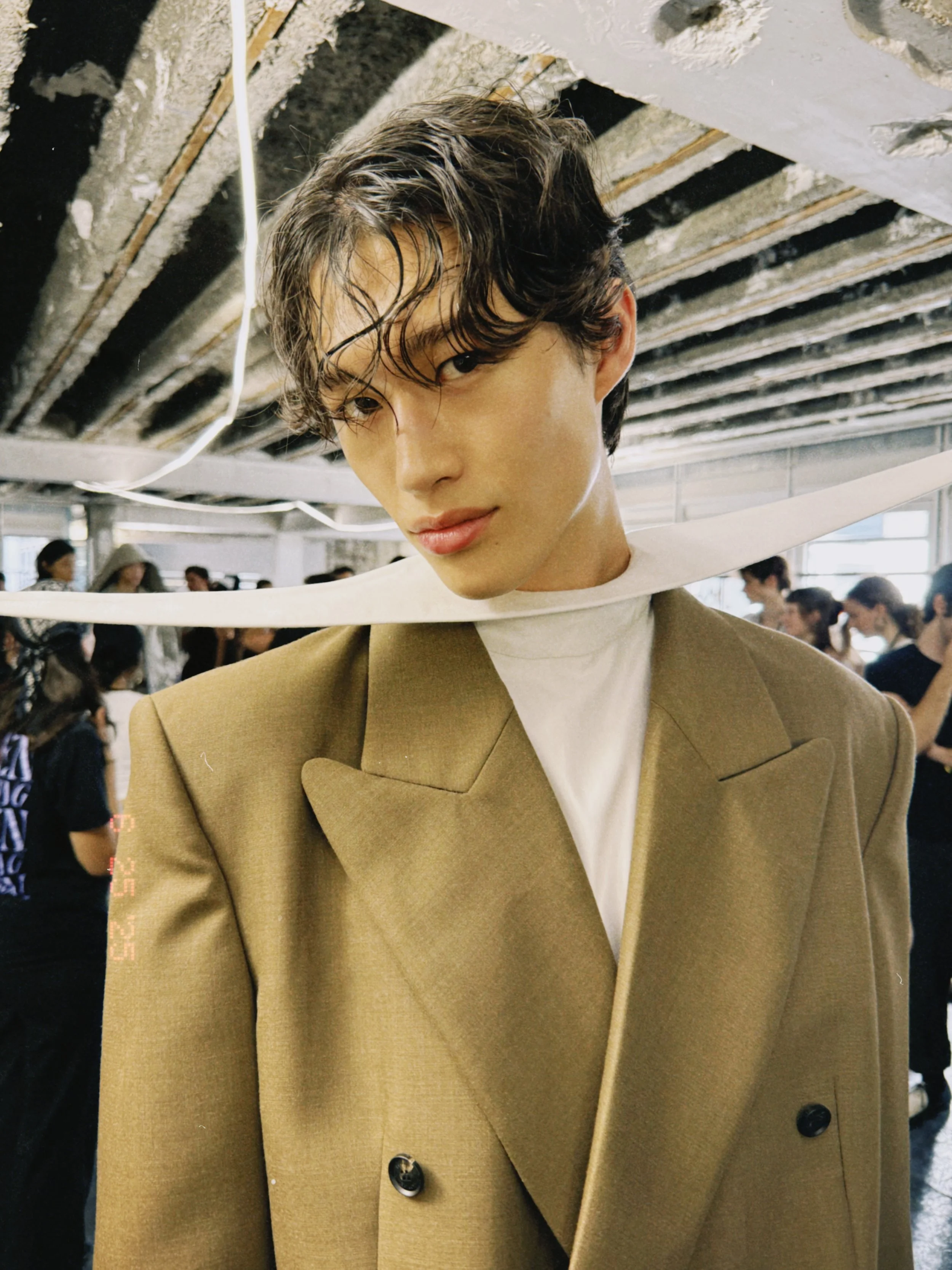 Garment worn during fitting and styling coordination as part of womenswear show preparation