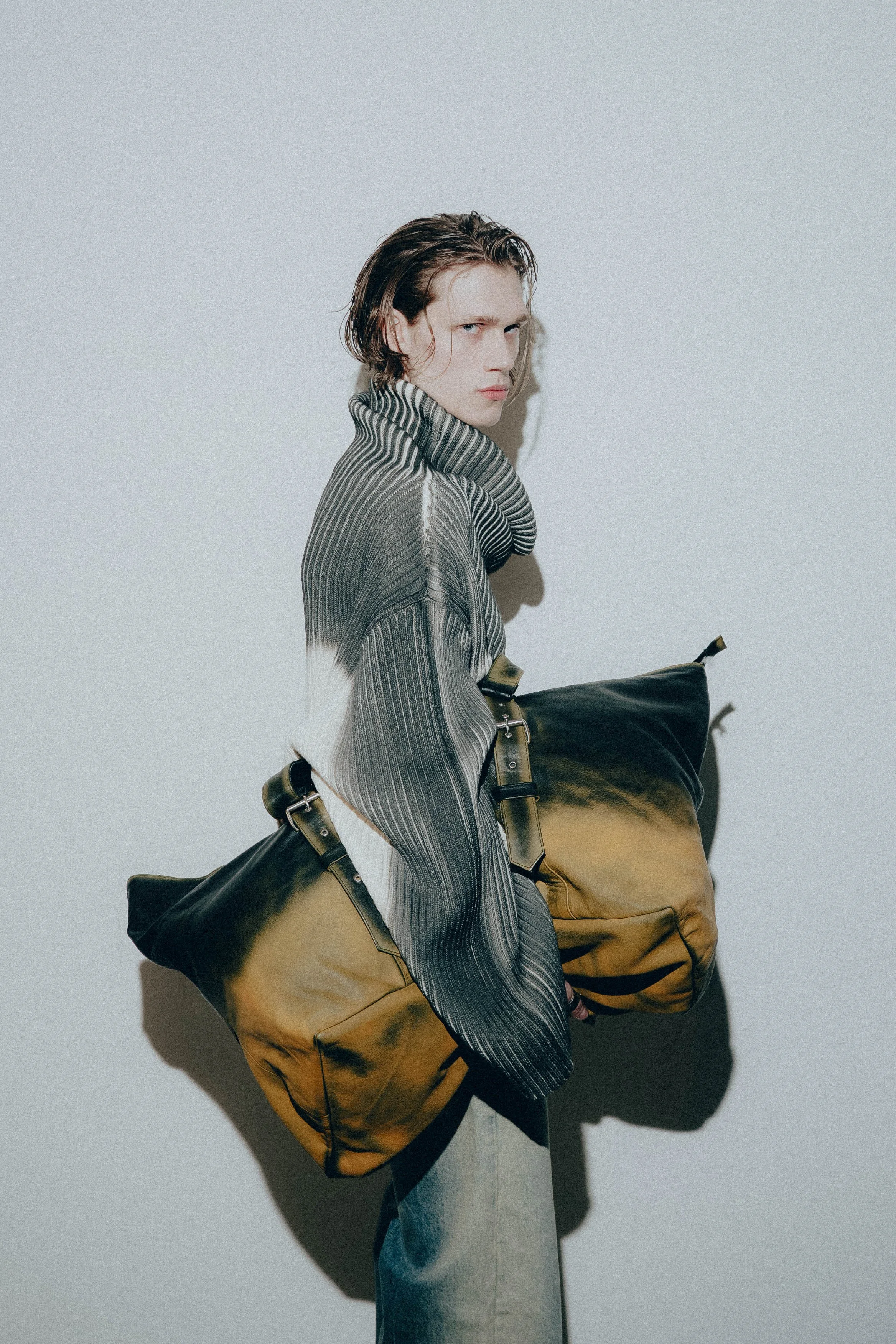 Garment worn during fitting to refine proportions and construction across the collection