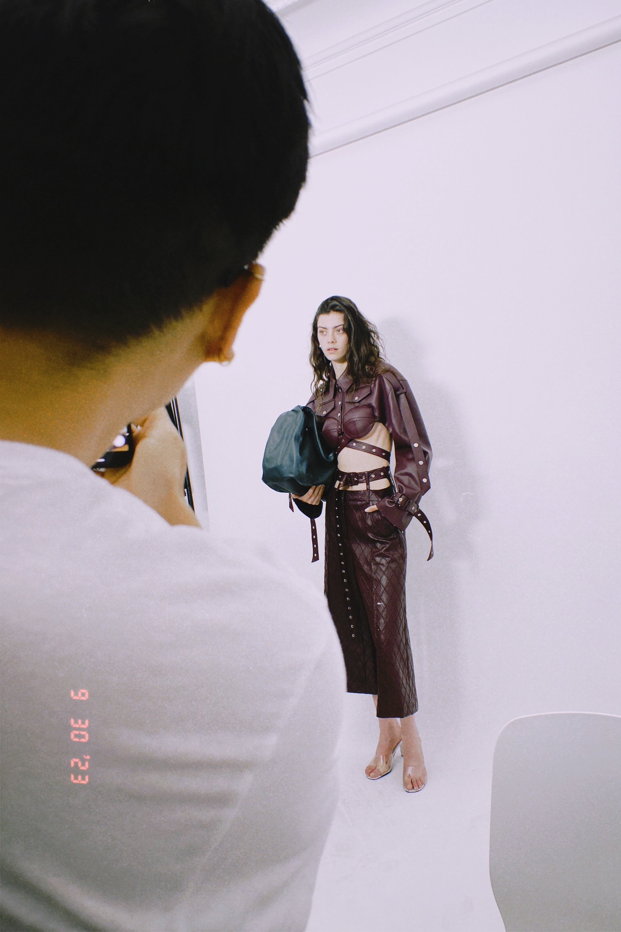 Womenswear look prepared for runway presentation during show preparation and fitting coordination