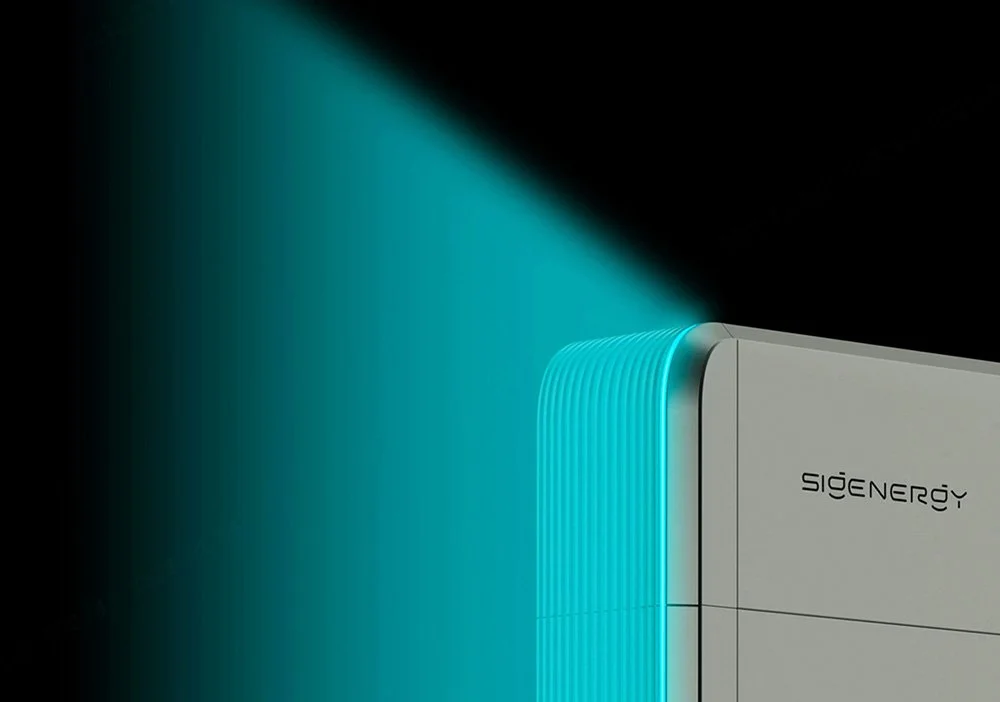 Close-up of a white SigEnergy device emitting a blue mist or light, set against a dark background.