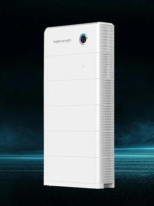 White tower-like machine with a camera lens at the top and the brand name 'SIGENERGY', set against a dark background with a digital blue glow at the base.