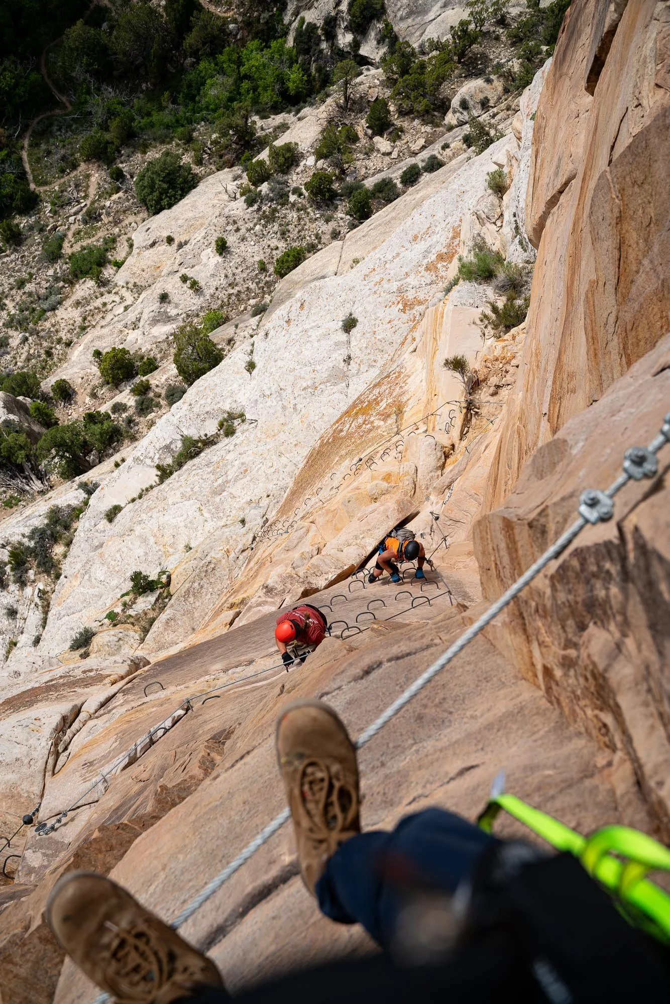 Climbers on the ashley gorge via ferrata with the required rental equipment