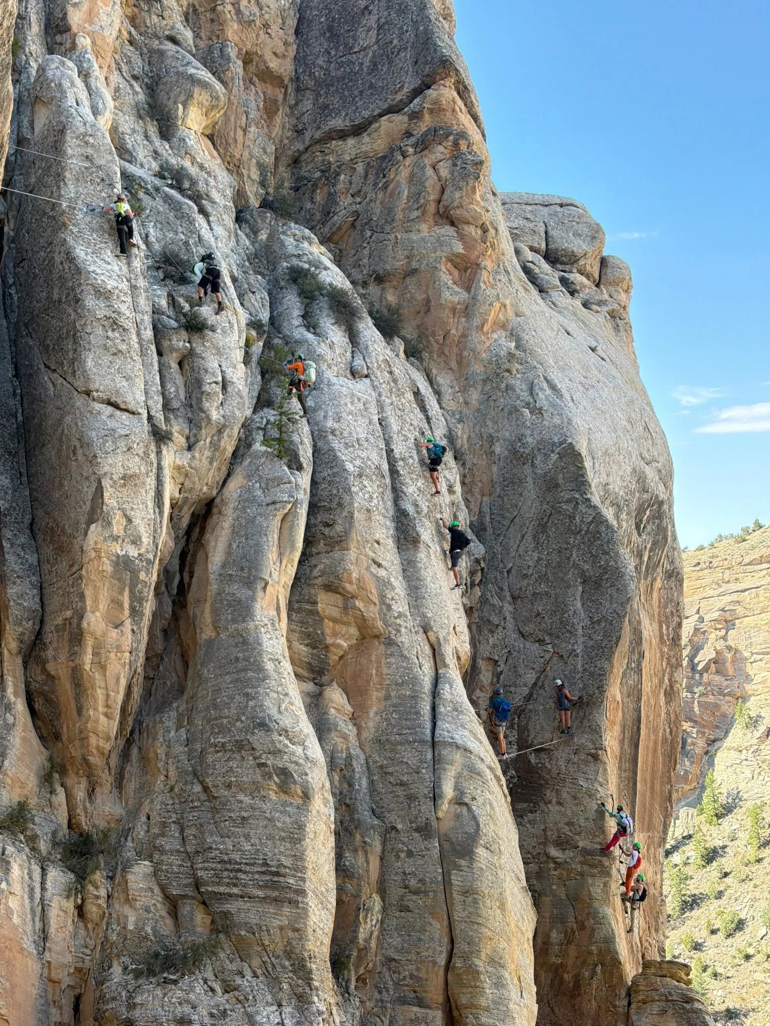 Exposed arête climbing along the Thagomizer route near Vernal, Utah.