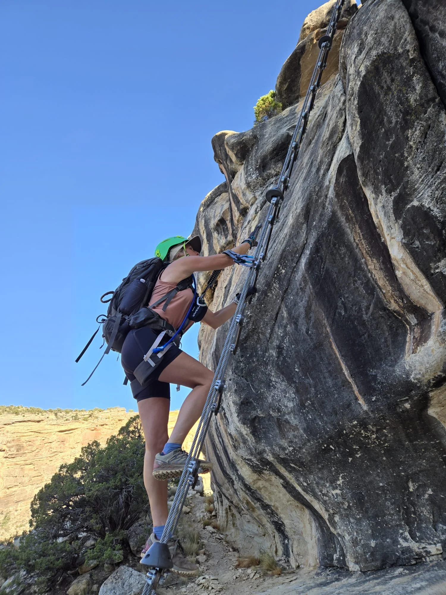 Climber entering The Pump through the Little Foot Ladder variation.