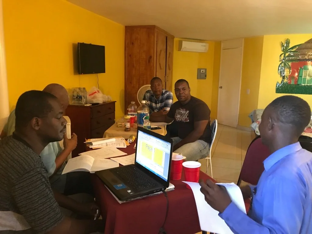 Gregory at computer during APSHA meeting in Haiti