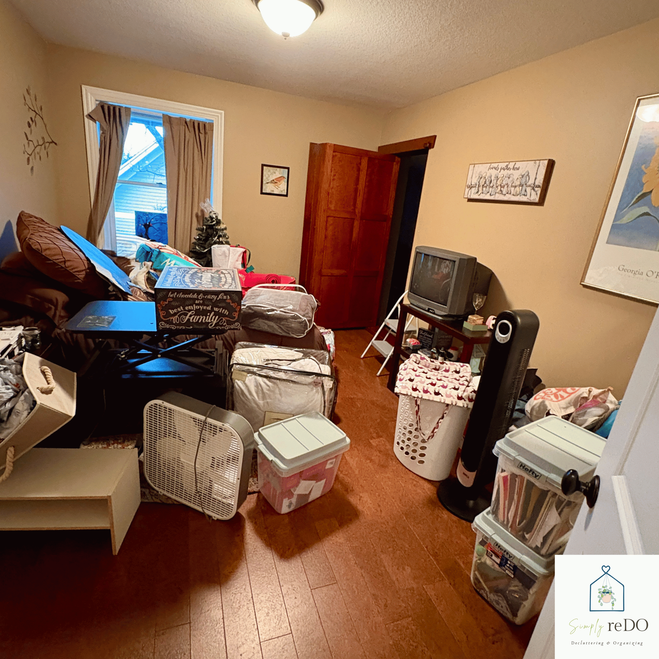 Guest bedroom before organization, straight-on view from the hallway entrance.