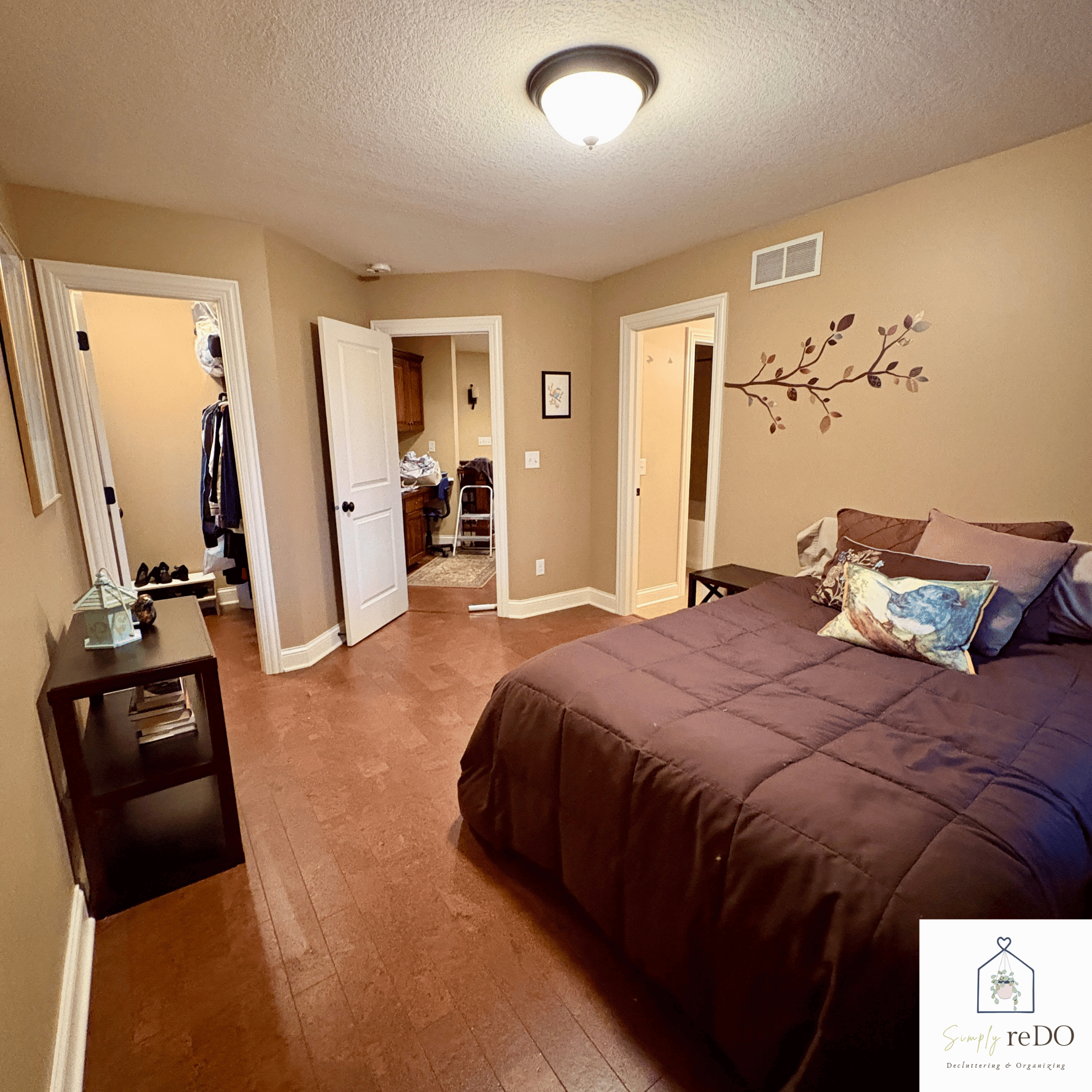 Guest bedroom after organization, view from the foot of the bed with a clear layout and improved flow.