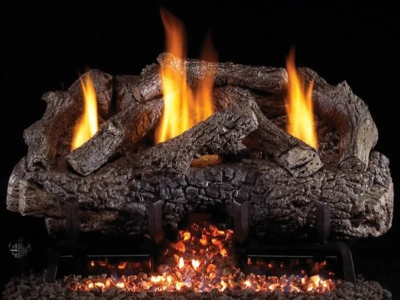 Fireplace with burning logs and flickering flames against a black background.