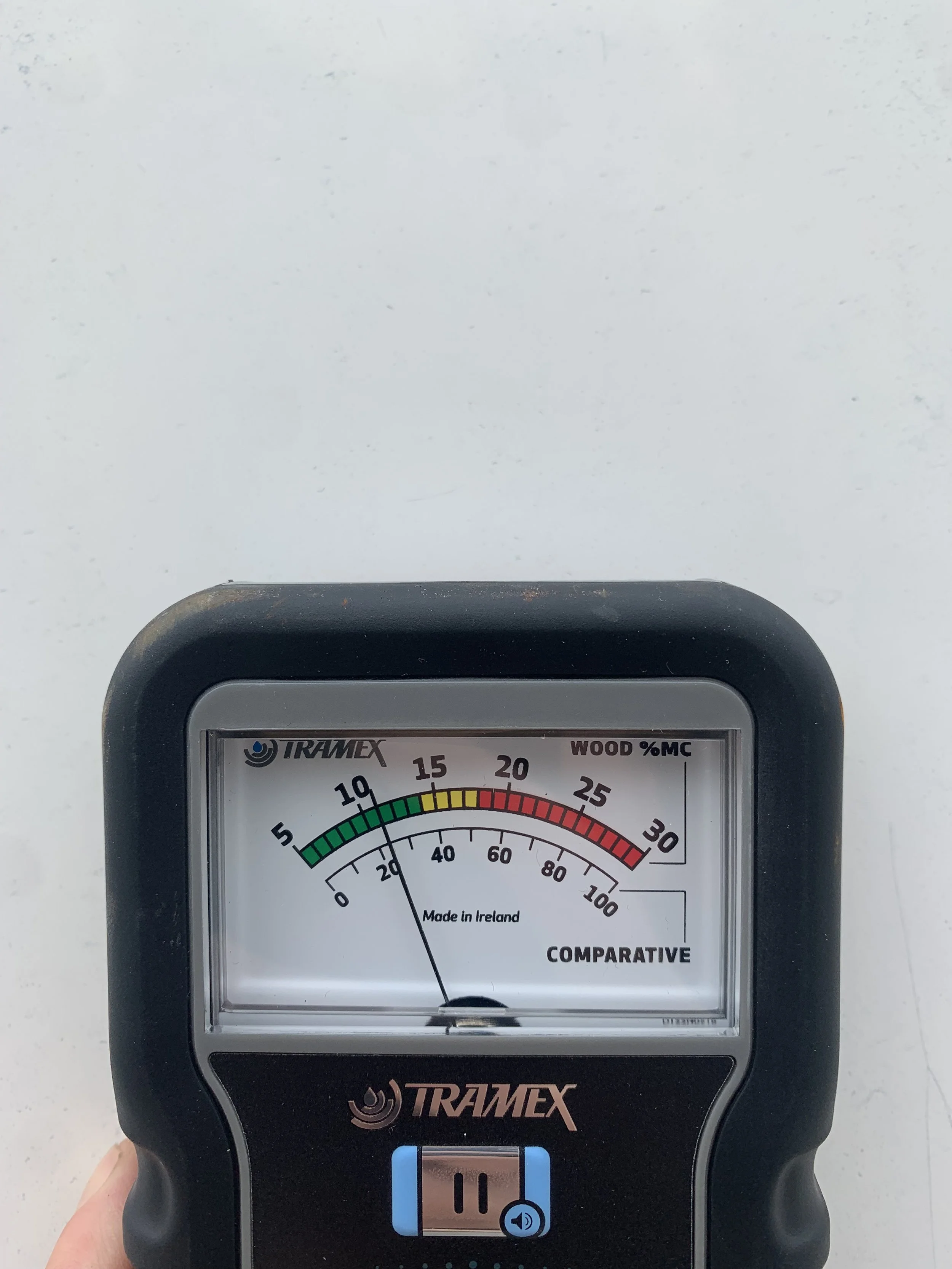 A Tramex  moisture meter showing a reading of just under 15% moisture content in GRP.