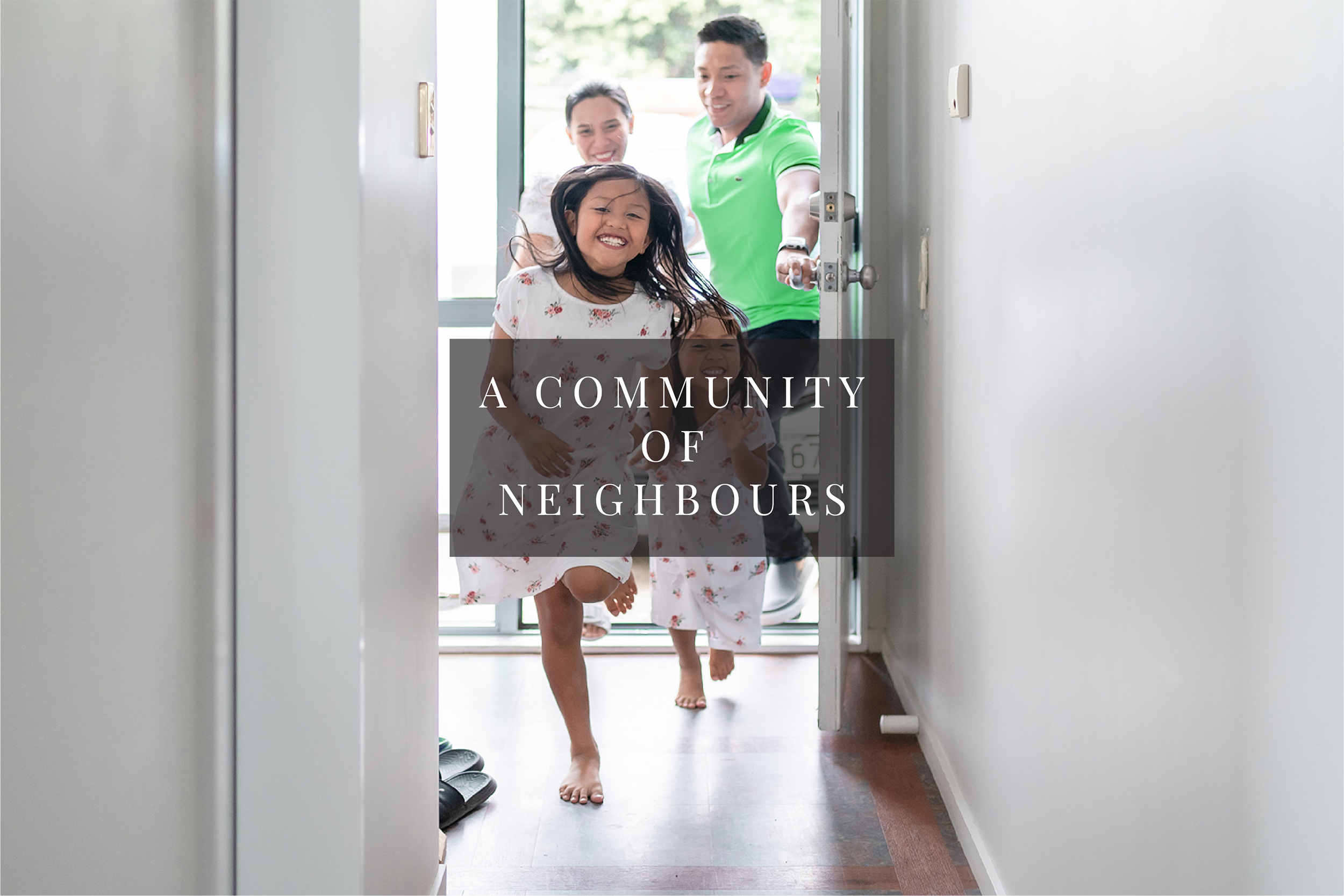 A family of four running into their home through the front door, smiling and happy, with the text overlay 'A Community of Neighbours'.