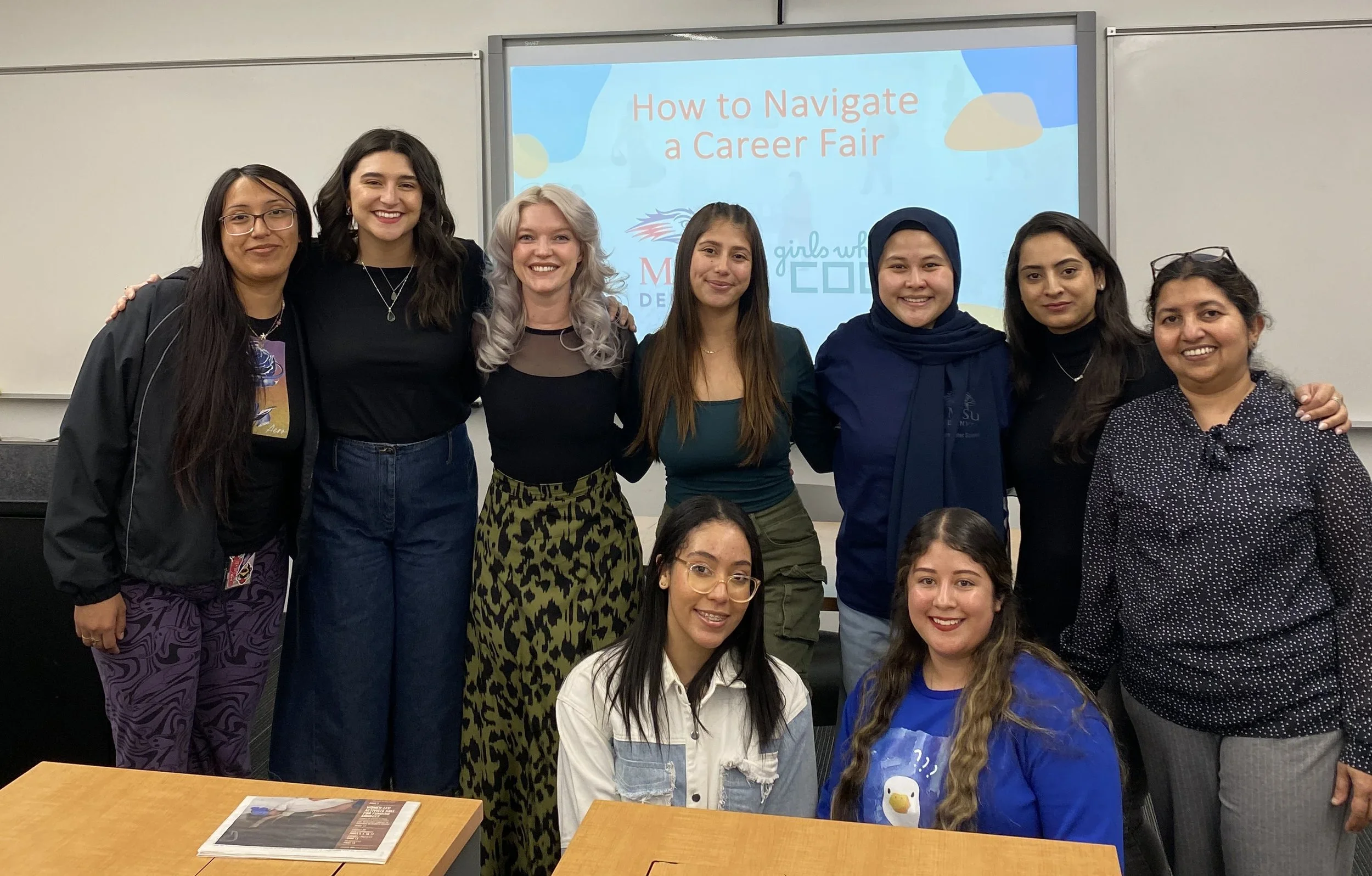 Whitney Haddad with Girls Who Code officers, group members, and Dr. Rajan at a "How to Navigate a Career Fair" event.