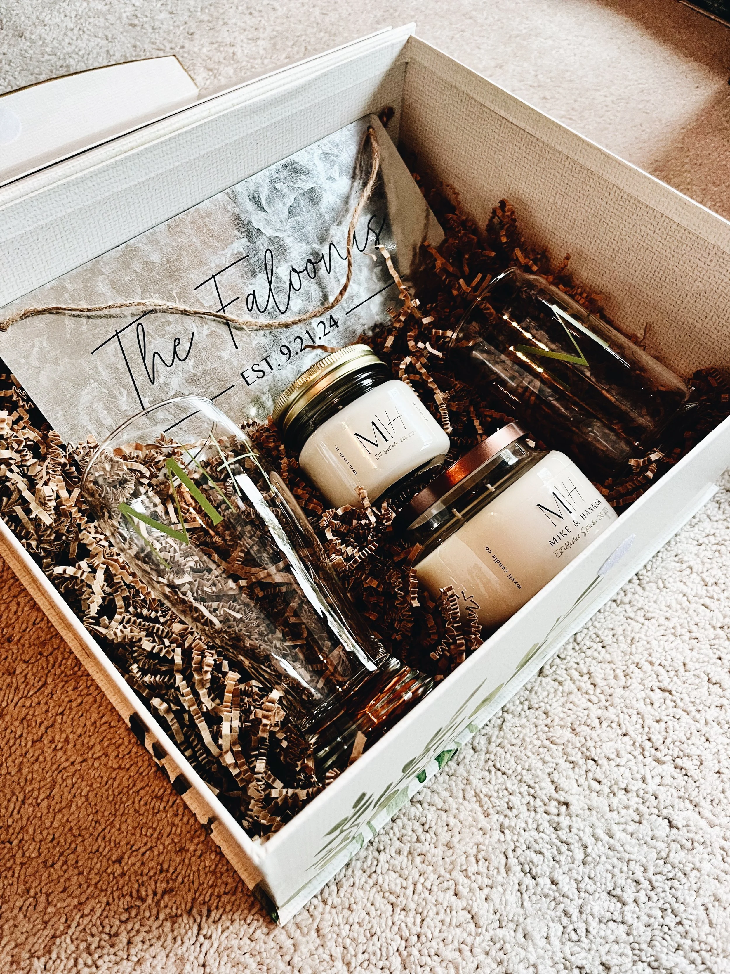 custom wedding gift box with candles, beer glasses, and a sign