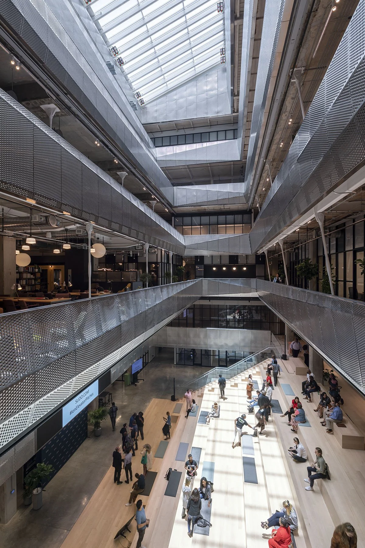 atrium with pitched gathering space occupied showing all 6 floors ©James Ewing