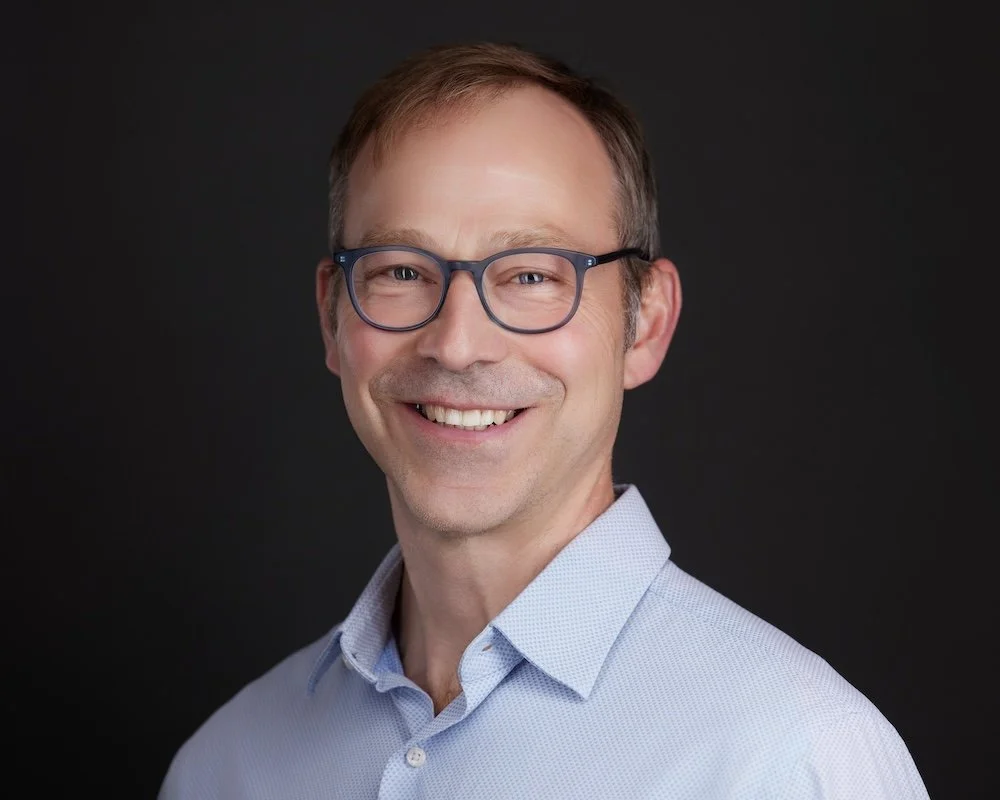 Joseph Welker, founding principal architect, smiling in a professional headshot.