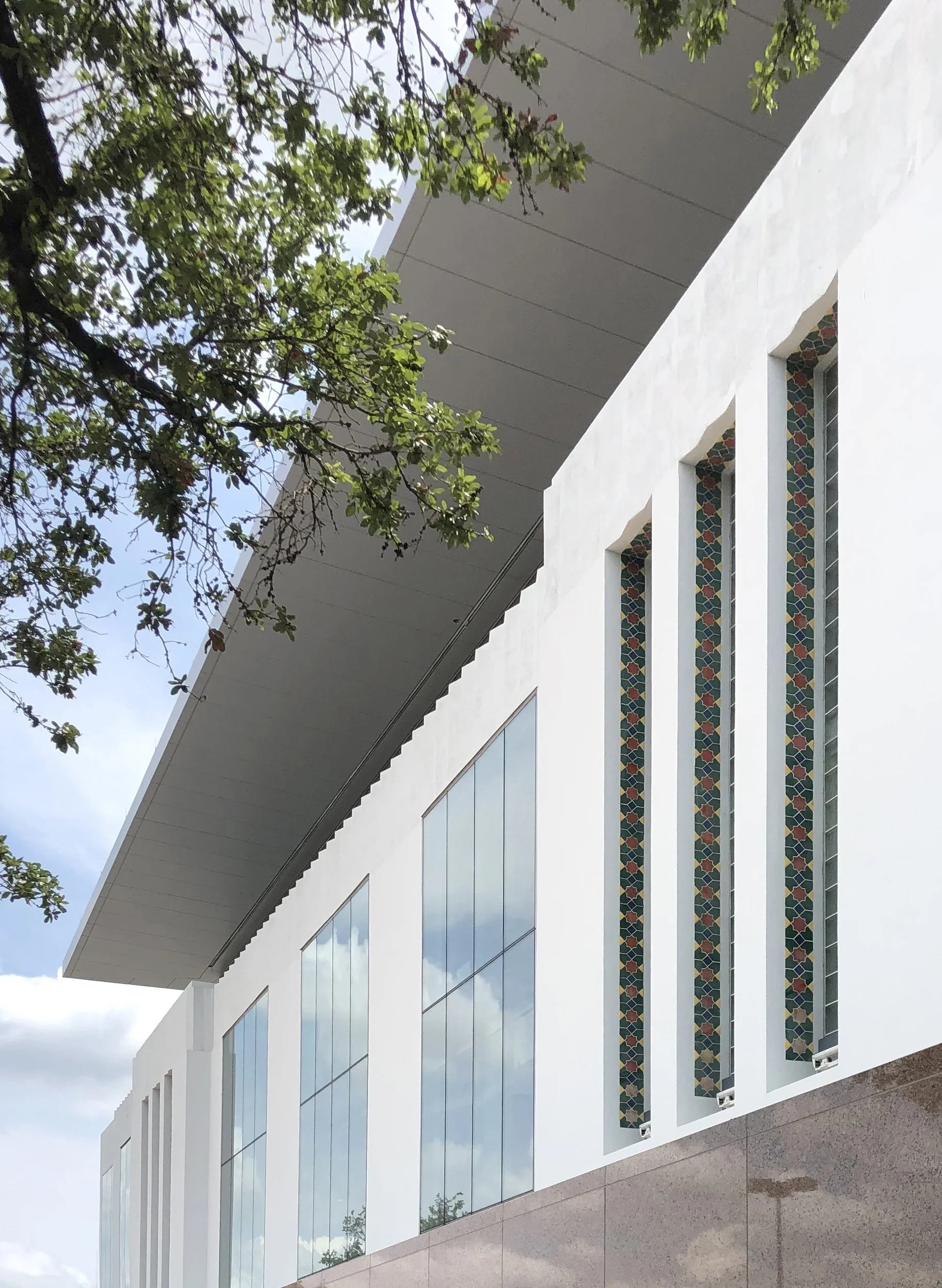 View of concrete with new windows and preserved colorful tile