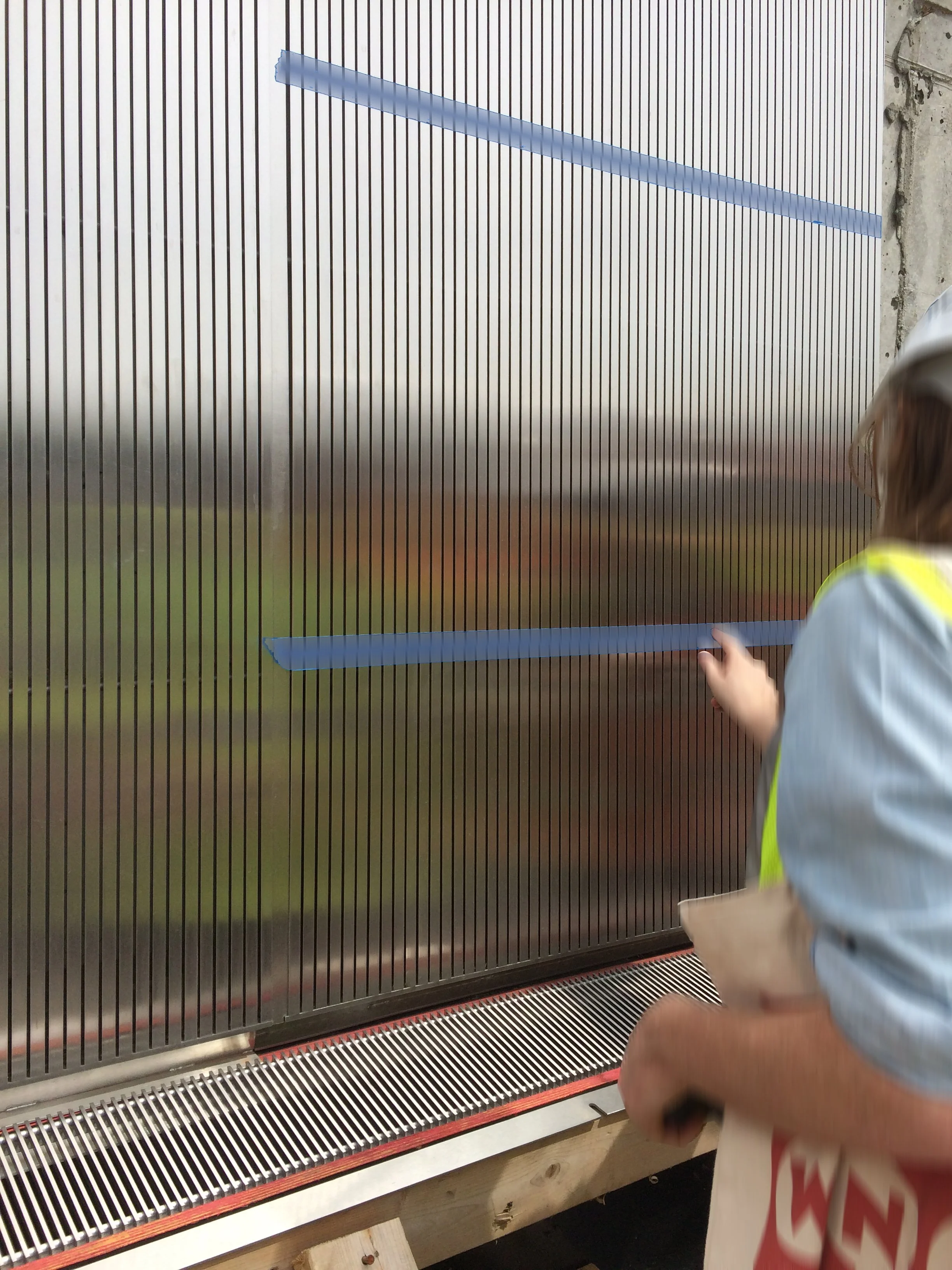 detail of onsite prototype of the screen at the entry