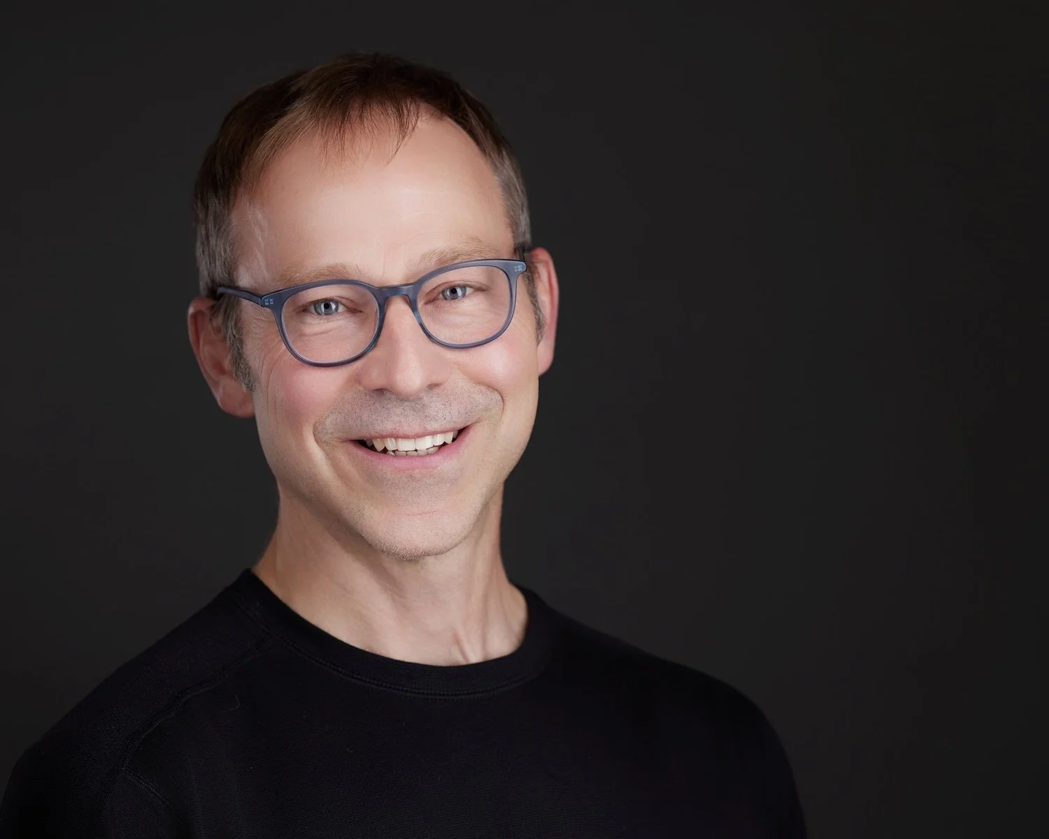 Joe Welker, architect, smiling in a professional headshot.