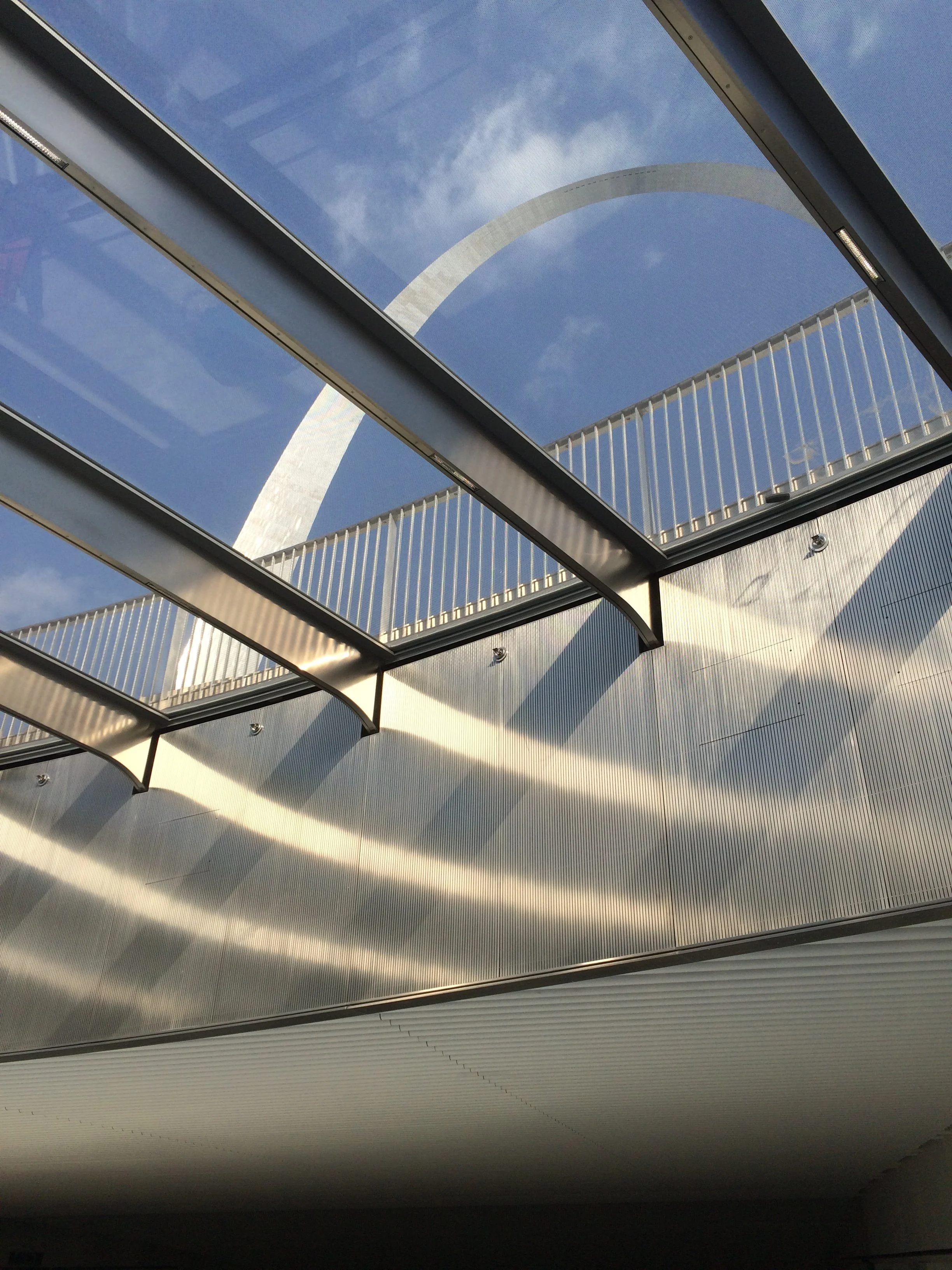 view of arch through skylight with light on stainless steel beams