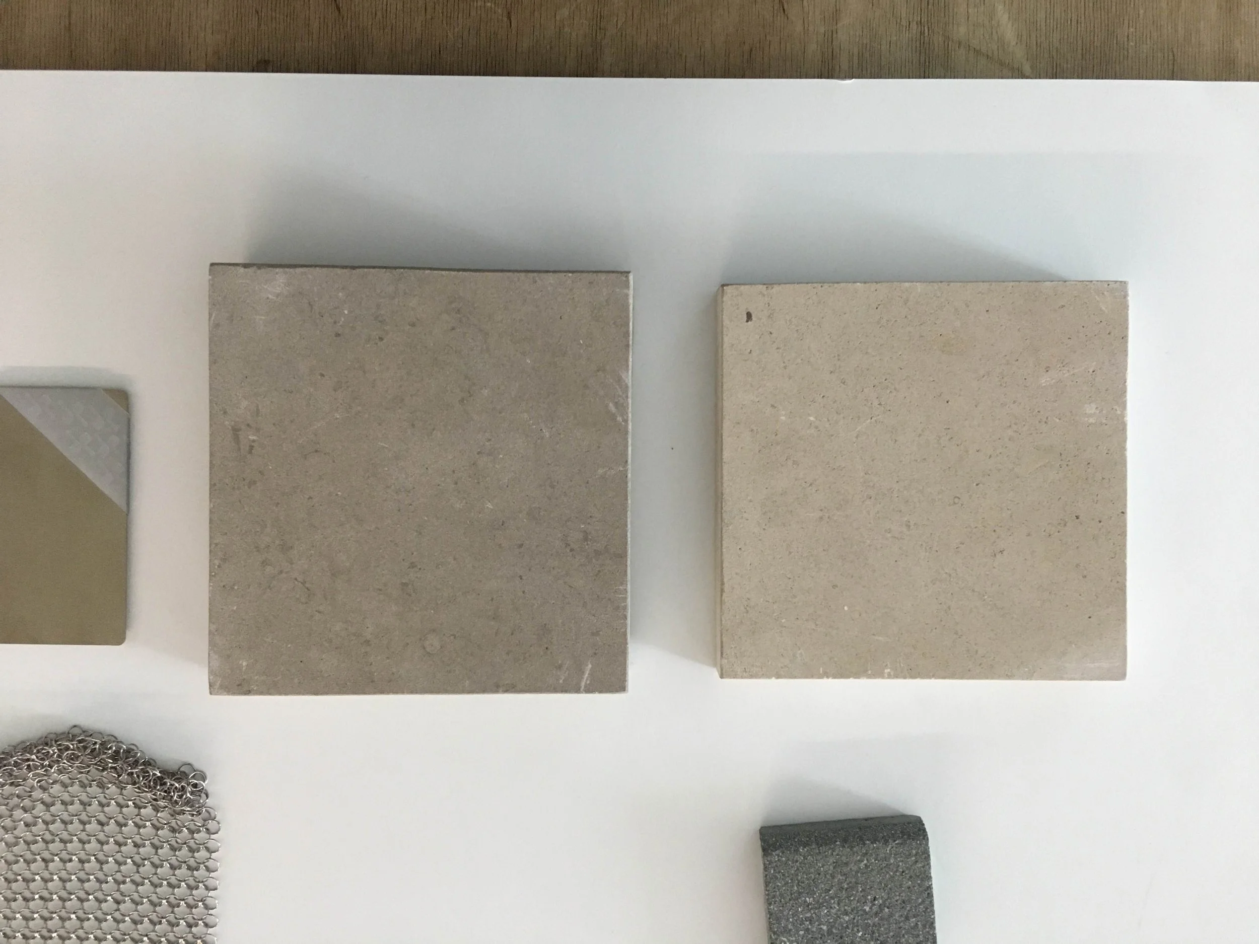 flat lay of materials including limestone and stainless steel